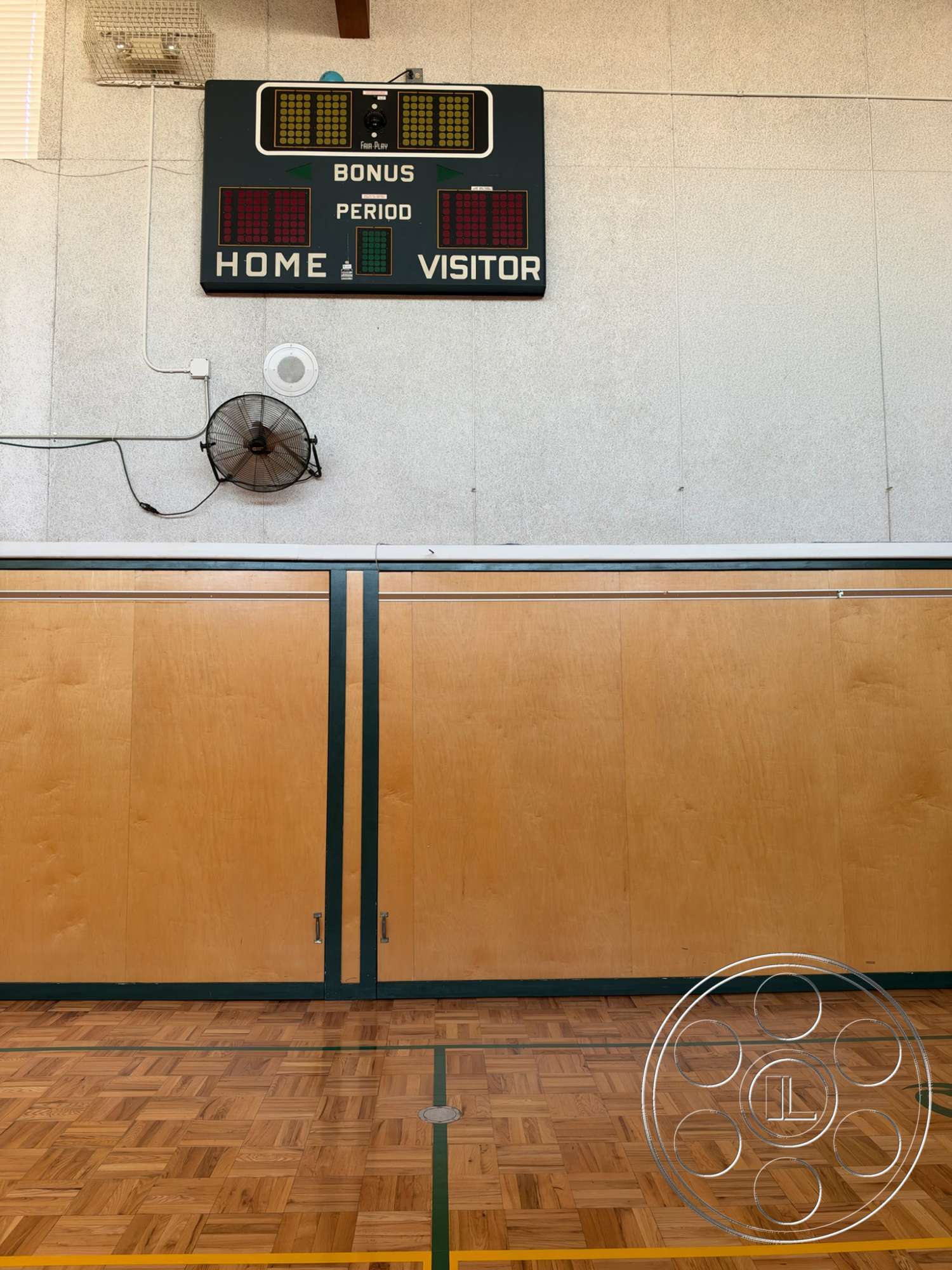 Community Center - exterior, ceiling fan, parquet flooring, wood panel walls, green line markings, basketball scoreboard, gymnasium setting