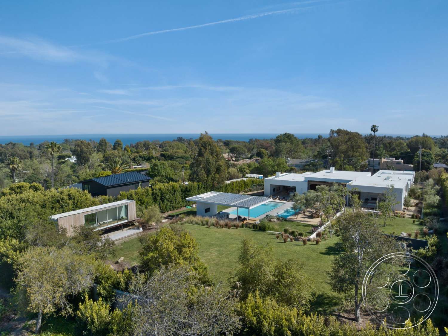 Modern 529 - exterior, landscaped garden, modern architecture, flat roof, lush greenery, floor-to-ceiling windows, ocean view, natural stone pathways, concrete pool deck, rectangular pool, hillside location, solar panel roof, open layout design, Wooden deck