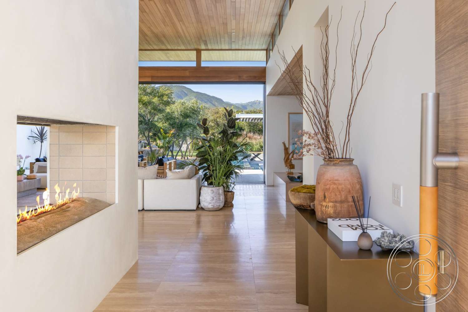 Modern 529 - natural light, indoor plants, integrated indoor-outdoor space, stone flooring, large floor-to-ceiling windows, open-concept layout, minimalist furniture style, smooth plaster walls, view of landscaped garden, natural wood ceiling planks, horizontal fireplace with concrete hearth, modern decorative pottery