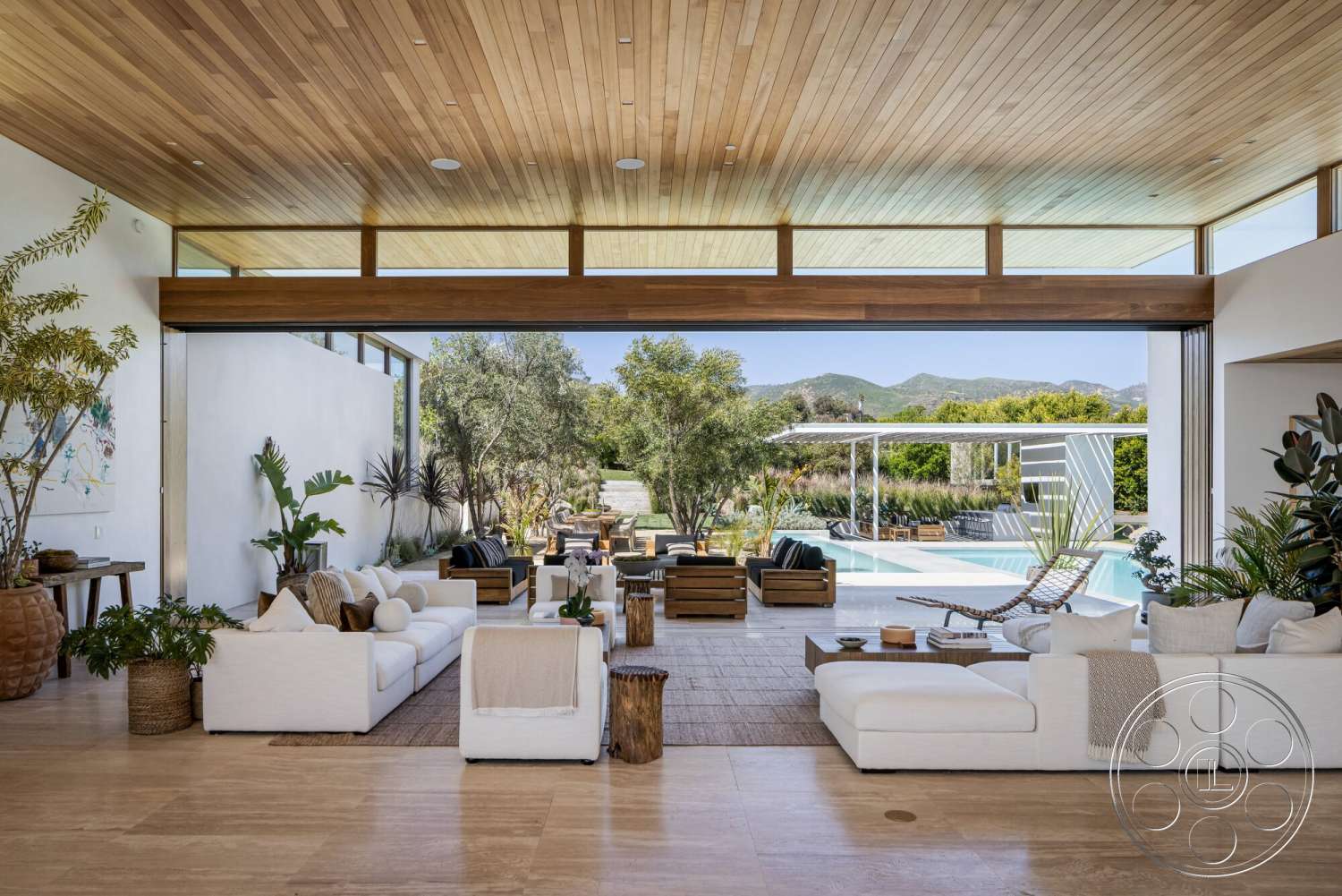 Modern 529 - exterior, potted plants, sliding glass doors, rectangular swimming pool, outdoor dining area, woven rug, natural landscape view, concrete patio flooring, wood beam ceiling, white painted walls, open floor plan living space, modern outdoor living area, luxury lounge chairs, stone garden steps