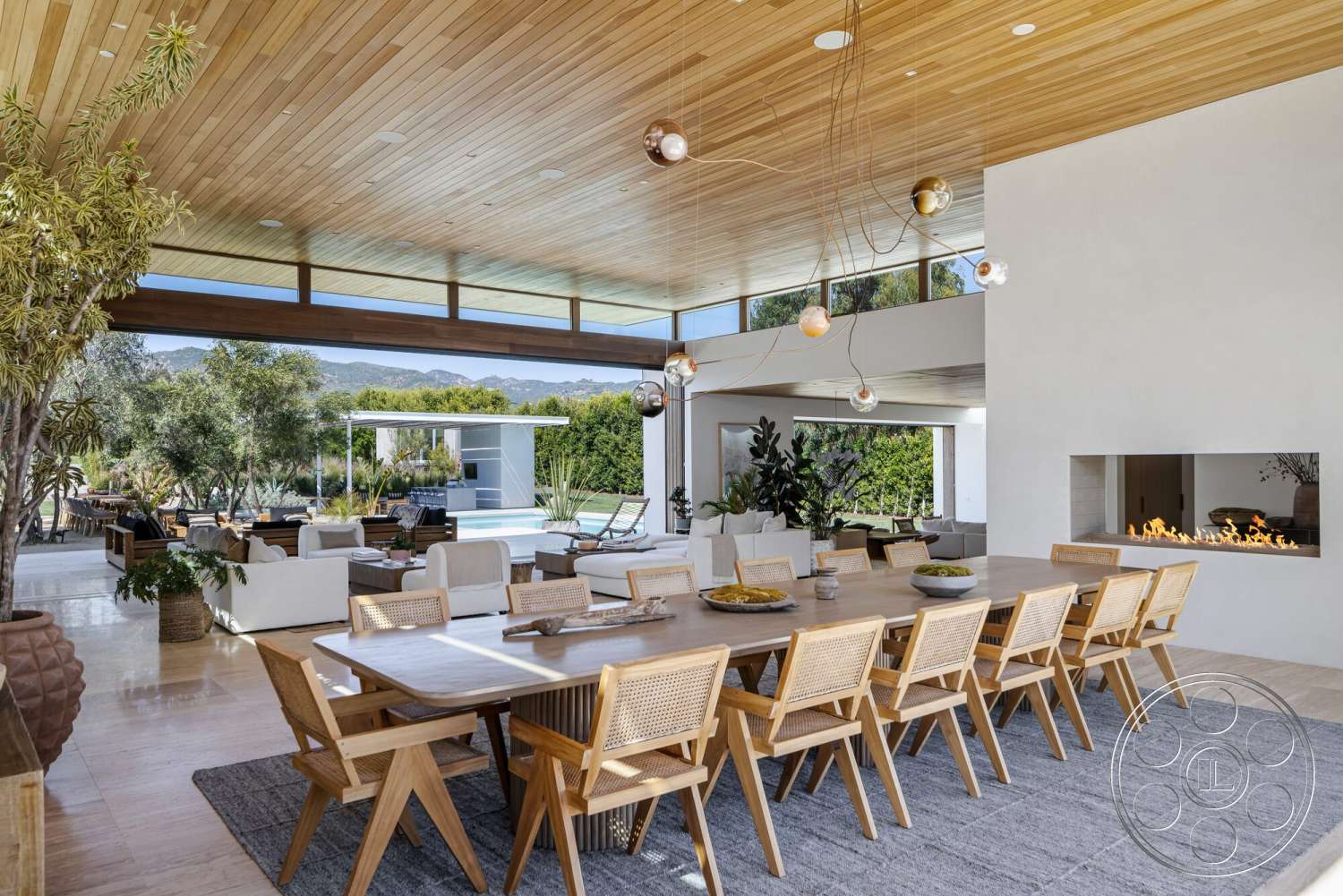 Modern 529 - natural light, exterior, landscaped garden, open floor plan, concrete flooring, glass sliding doors, outdoor living space, pool area, mountain view, rectangular dining table, linear gas fireplace, suspended light fixtures, modern dining area, woven dining chairs, wood beam ceiling, textured cream walls
