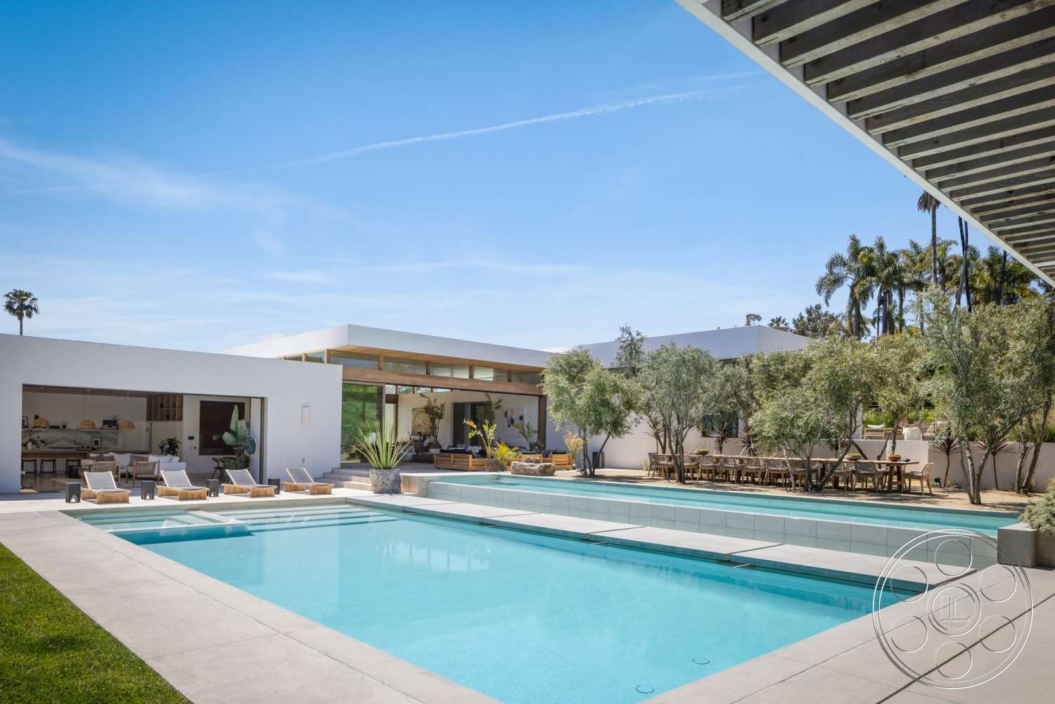 Modern 529 - exterior, flat roof, floor-to-ceiling windows, concrete steps, modern architectural style, concrete pool deck, rectangular pool, concrete patio flooring, wood beam ceiling, aluminum outdoor furniture, lush garden landscaping, palm tree surroundings, open outdoor dining area, desert home setting, grazed grass lawn