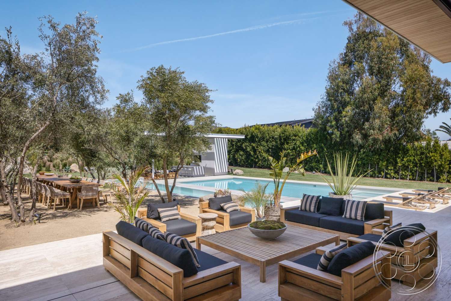 Modern 529 - exterior, palm trees, rectangular swimming pool, outdoor dining area, open-air environment, modern landscape design, green shrubbery, built-in seating, concrete pool deck, poolside lounge area, textured wood ceiling, natural stone patio flooring, wood patio furniture