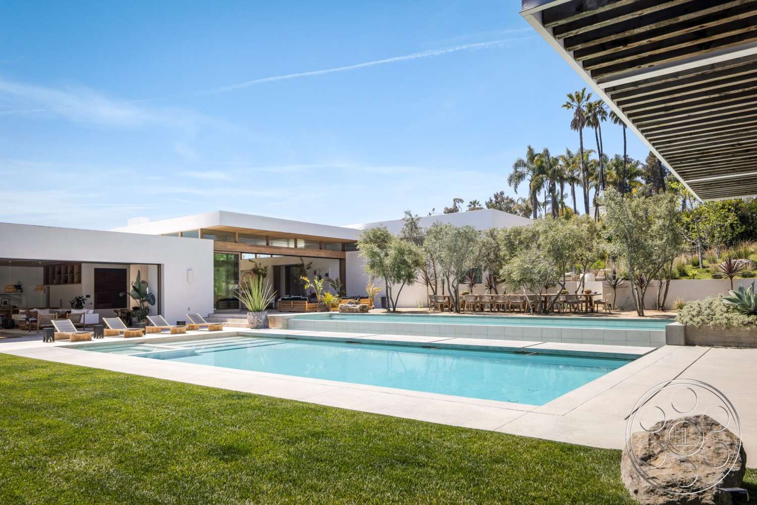 Modern 529 - large windows, contemporary style, exterior, landscaped garden, white stucco walls, modern architecture, flat roof, minimalist design, open floor plan, glass sliding doors, outdoor dining area, lawn area, rectangular pool, concrete patio flooring, concrete pool border, palm tree landscaping, wood beam overhang