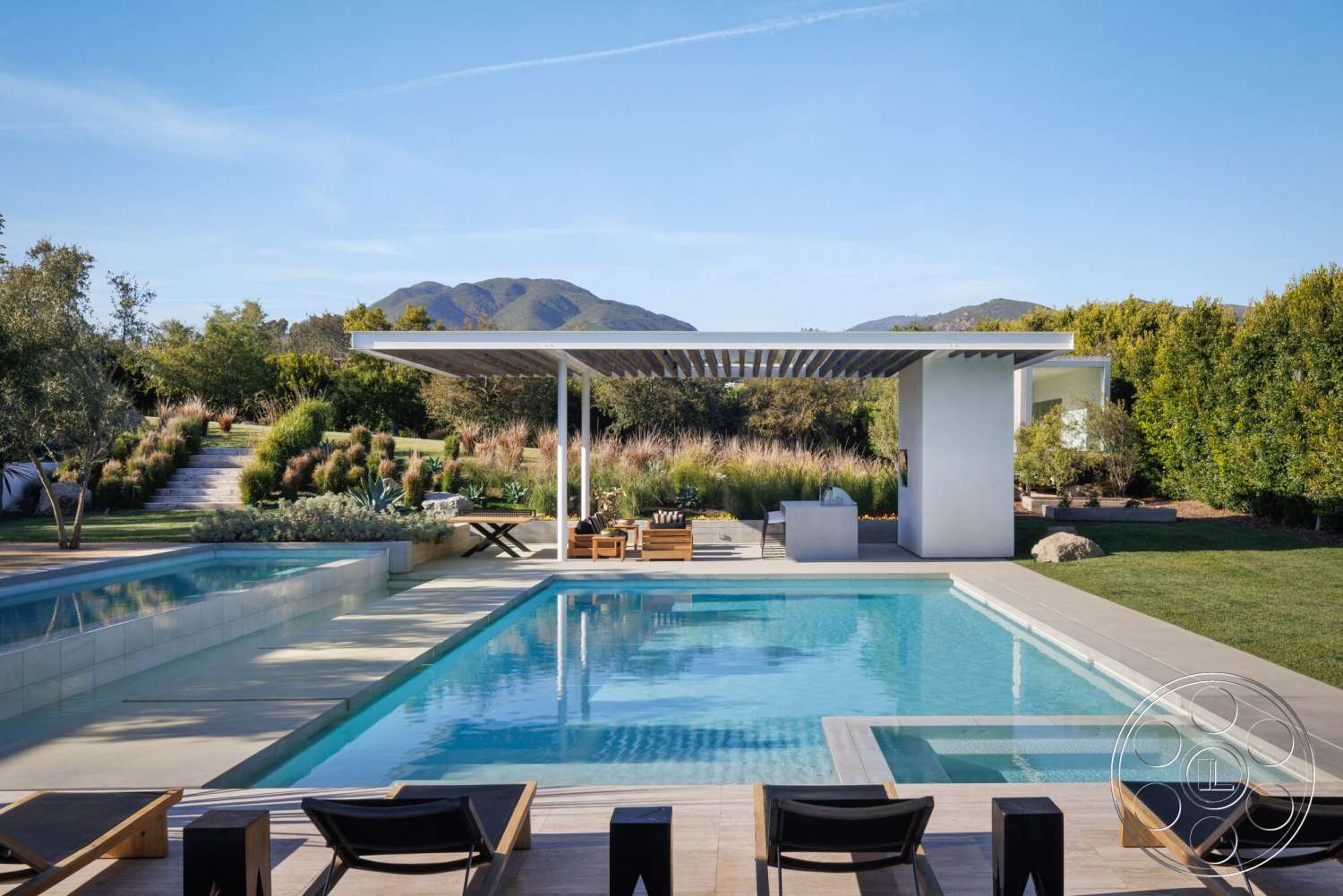 Modern 529 - exterior, glass sliding doors, modern outdoor furniture, rectangular swimming pool, lawn area, mountain view, hardwood deck, stepping stone pathway, concrete patio flooring, landscaped garden setting, wood pergola structure, open-air lounge area, concrete pool coping, slate stone features