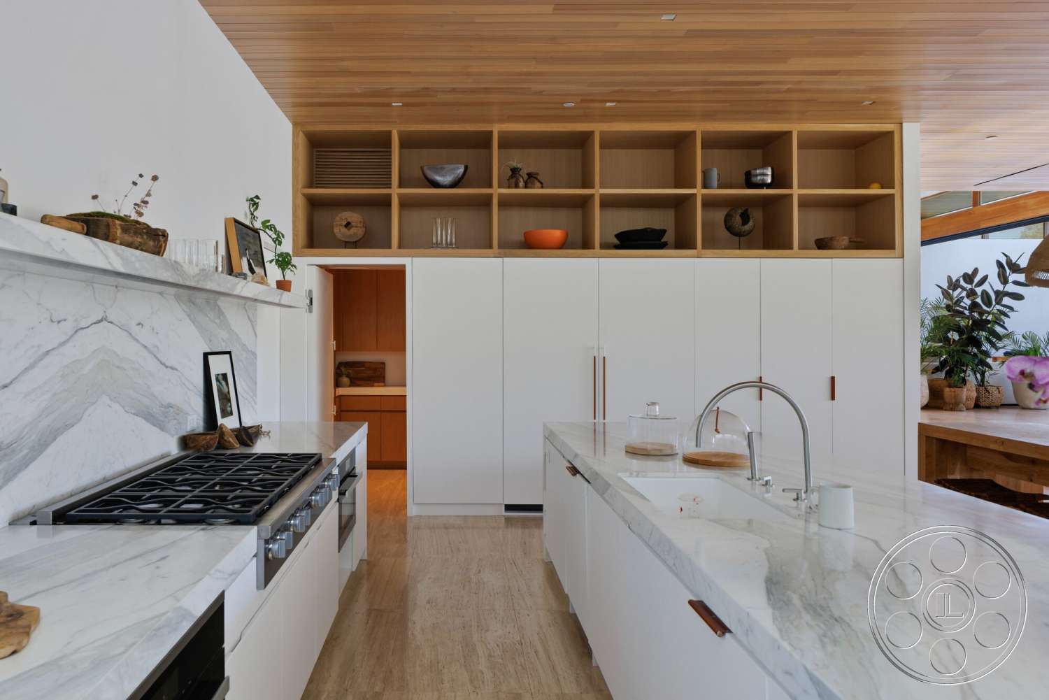 Modern 529 - neutral color palette, minimalist design, bright natural light, gas cooktop, open shelving, white cabinetry, marble countertop, light wood ceiling, marble backsplash, spacious kitchen layout, textured wood accents, natural wood shelves