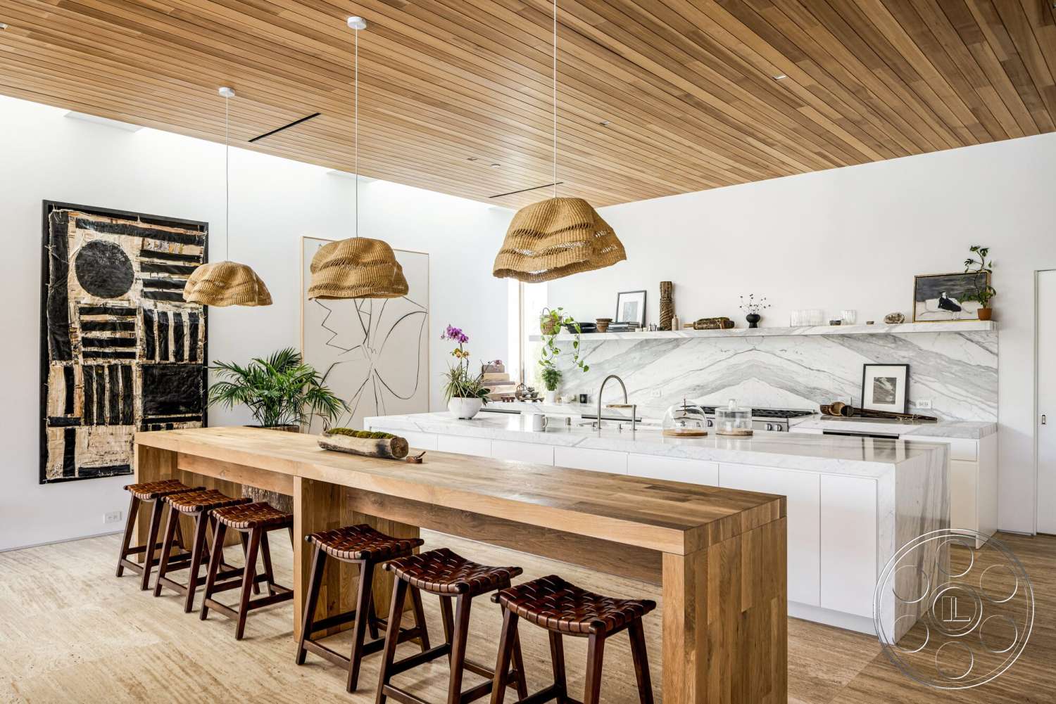 Modern 529 - white walls, natural light, minimalist design, woven bar stools, potted plants, concrete floor, wooden dining table, modern aesthetic, artwork on wall, wooden countertop, open concept kitchen, marble kitchen backsplash, wood plank ceiling, kitchen island with marble top