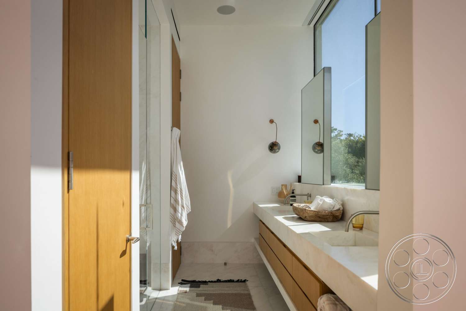Modern 529 - neutral color palette, textured wall, wood cabinetry, modern light fixtures, floor-to-ceiling windows, soft natural light, glass shower doors, contemporary bathroom design, modern faucet fixtures, marble bathroom countertops, open bathroom layout, minimalist shower enclosure, wood bathroom door