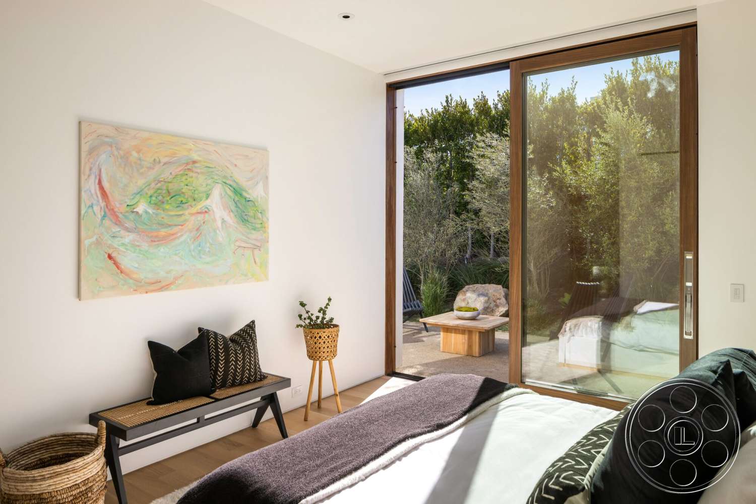 Modern 529 - exterior, textured wall art, woven basket, floor-to-ceiling windows, black accent pillows, indoor plant decor, natural landscape view, modern minimalist design, light hardwood bedroom floors, wood frame doors, wooden outdoor table, wooden bench with woven seat