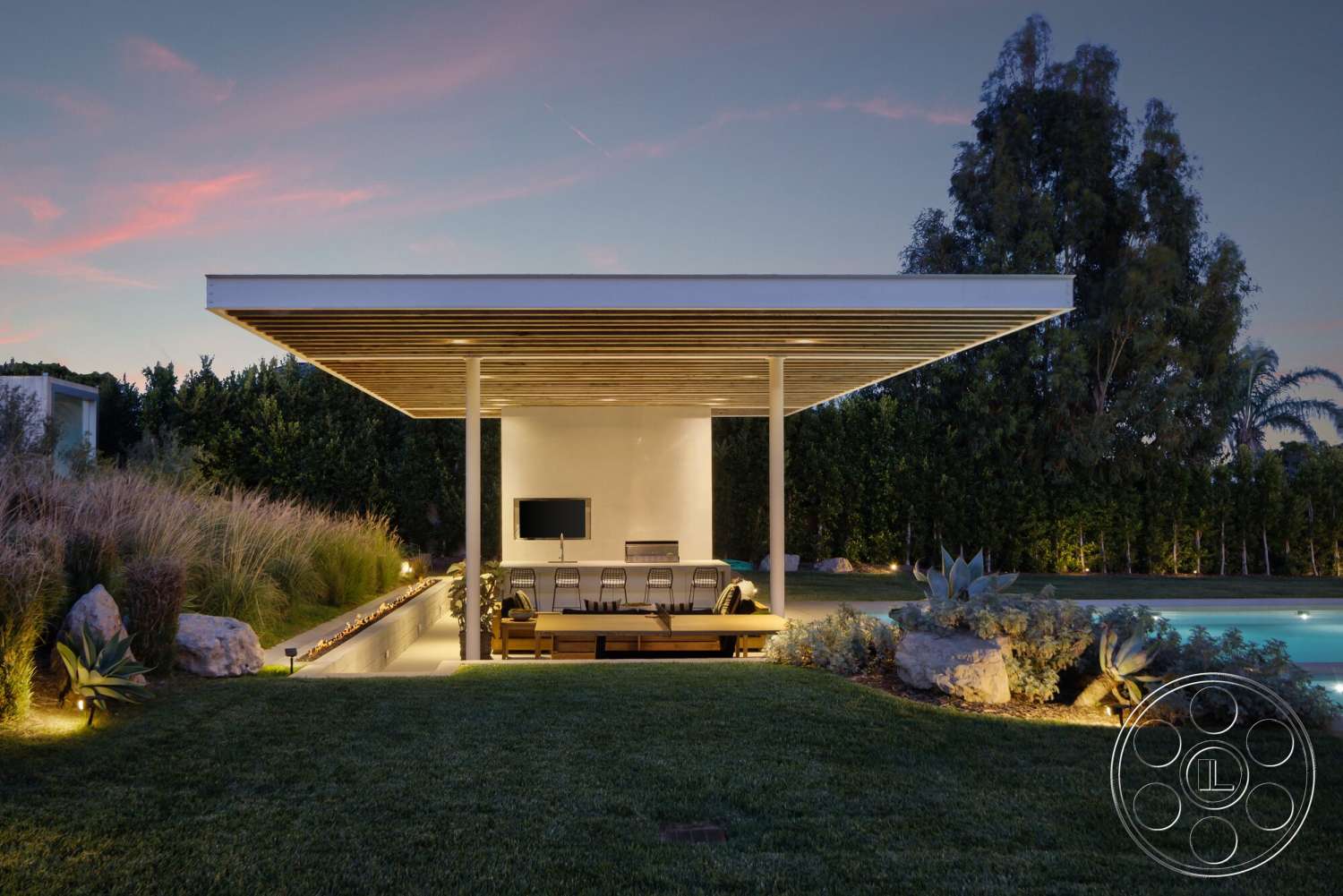 Modern 529 - exterior, rectangular swimming pool, landscape lighting, outdoor entertainment area, poolside setting, concrete patio floor, modern minimalist architecture, tropical plant landscaping, wooden lounge seating, steel pergola roof, glass-enclosed outdoor area, stone fire feature, grassy landscape