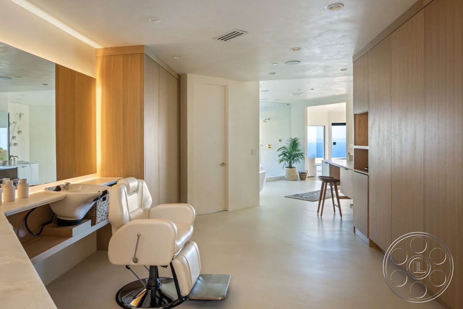 Modern 528 - natural light, minimalist design, plant decor, open floor plan, glass shower enclosure, concrete flooring, light wood cabinetry, functional workspace, white painted walls, modern styling, hair salon seating, vanity area with sink