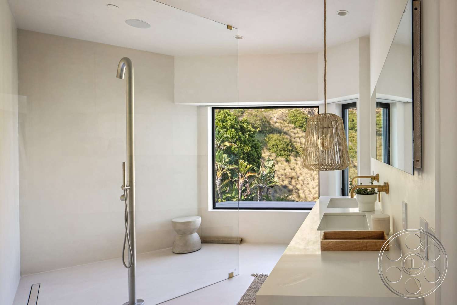 Modern 528 - glass shower enclosure, floor-to-ceiling windows, white cabinetry, textured plaster walls, gold faucet fixtures, natural landscape view, minimalist lighting fixture, neutral tile flooring, marble bathroom sink countertop, brushed steel shower fixture, wooden accent stool