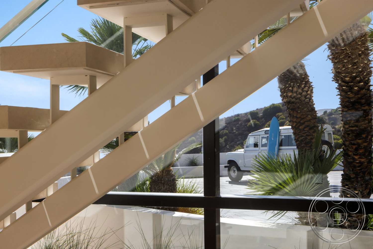 Modern 528 - natural light, open floor plan, glass railing, vaulted ceiling, contemporary design elements, modern architectural style, white plaster walls, spacious entryway, view of outdoor space, palm tree landscaping, floating concrete stairs
