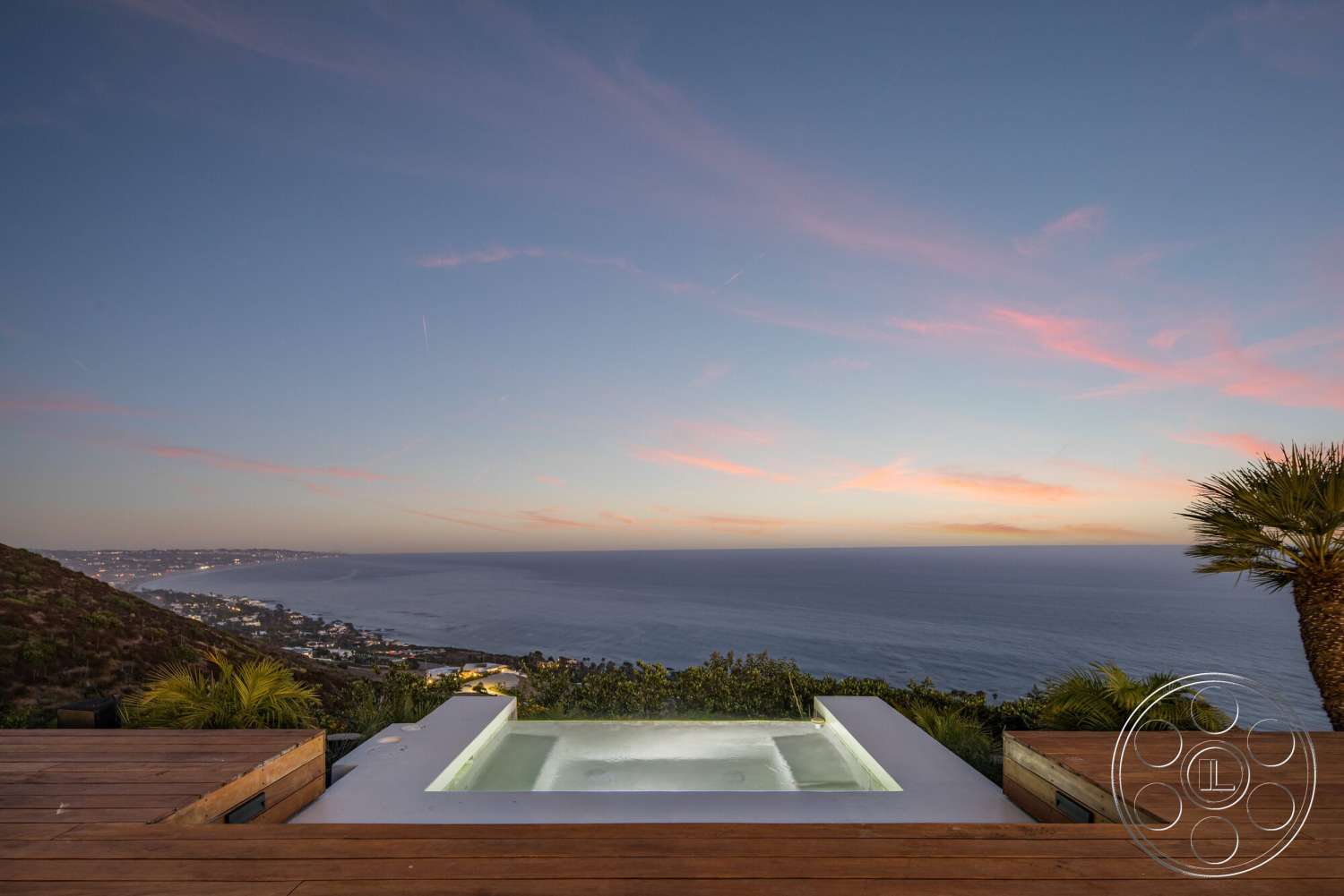 Modern 528 - exterior, tropical landscaping, hillside location, wood deck flooring, oceanfront view, modern outdoor living space, rectangular spa, concrete spa border, panoramic sunset sky