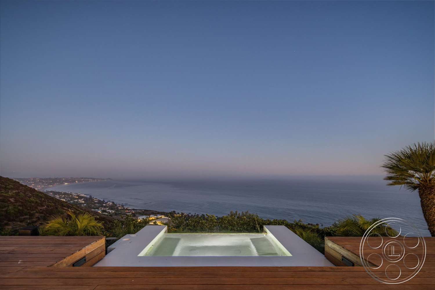 Modern 528 - exterior, lush landscaping, modern architectural style, hillside location, wood deck flooring, oceanfront view, concrete spa surround, rectangular spa shape
