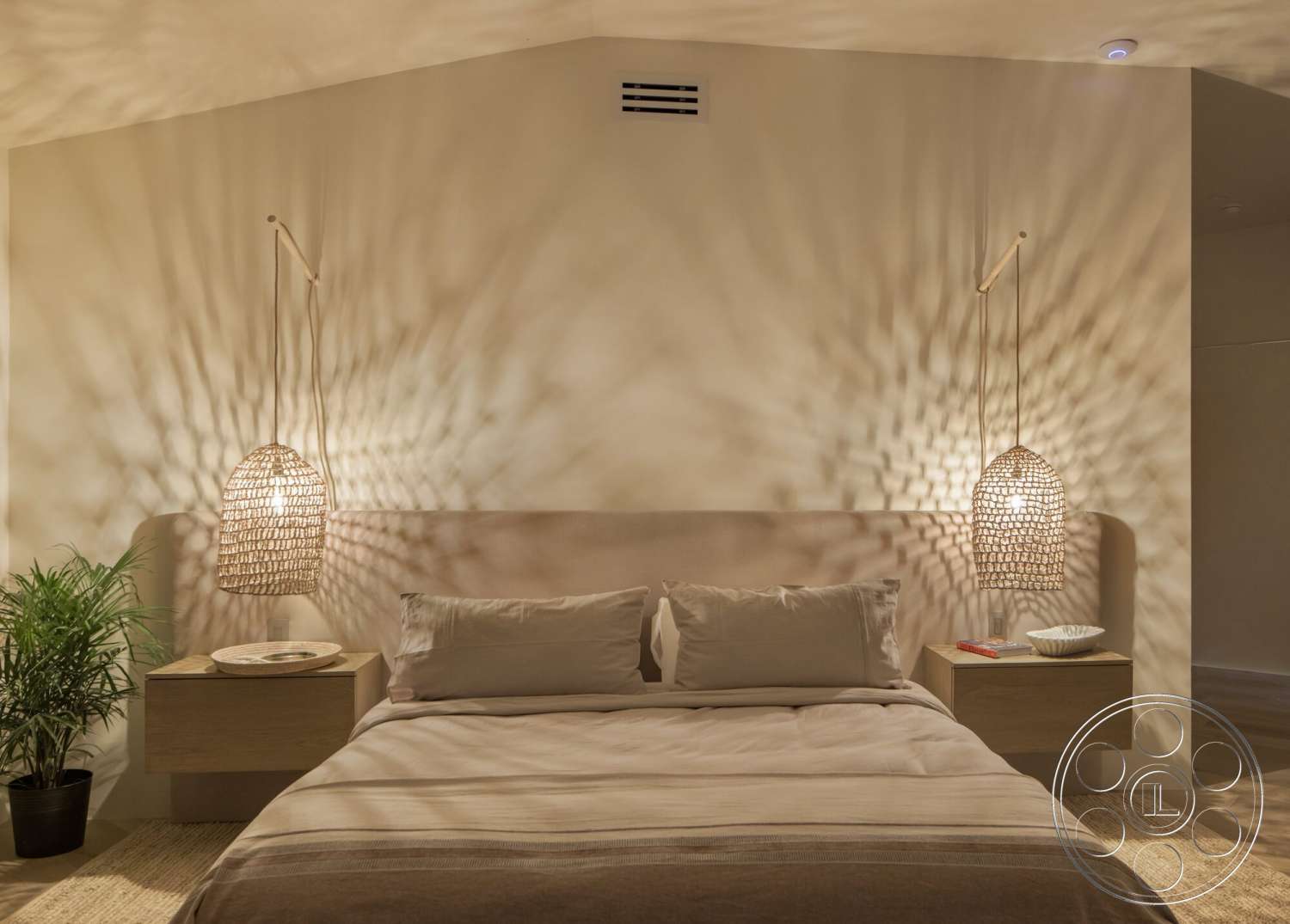 Modern 528 - neutral color palette, textured ceiling, woven pendant lighting, plaster wall treatment, minimalist bedroom design, light wood nightstands, large floor plant, soft bedding textiles, bedroom space with warm lighting