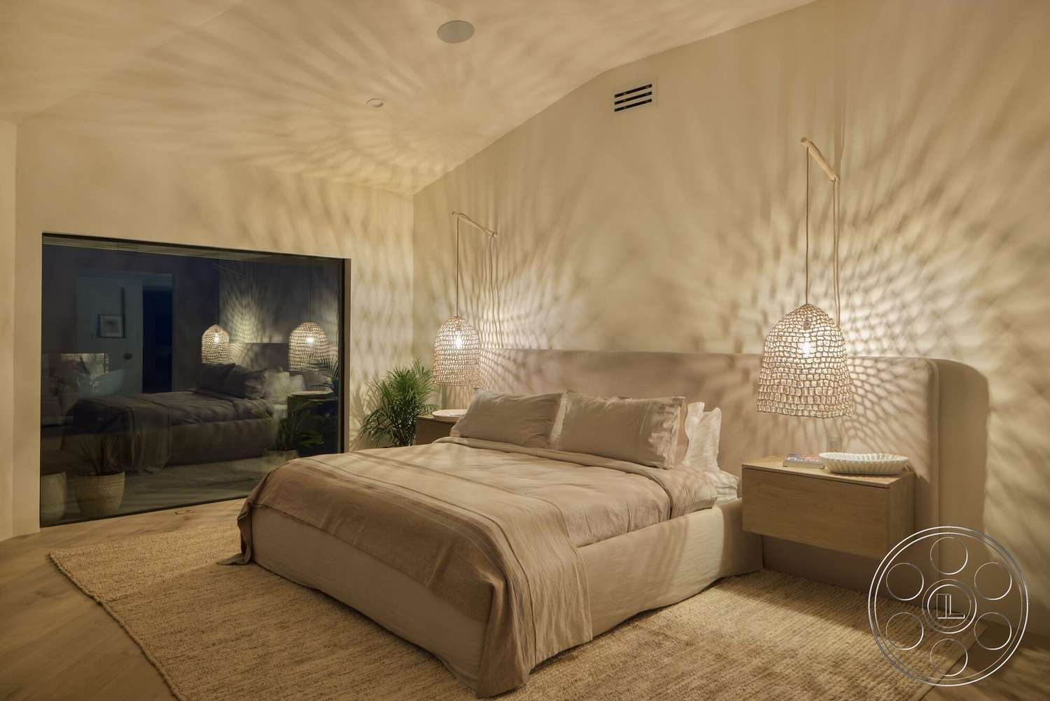 Modern 528 - wood flooring, indoor plants, soft lighting, plush bedding, textured ceiling, master bedroom, woven area rug, glass wall, minimalist nightstand, white painted walls, hanging woven light fixtures