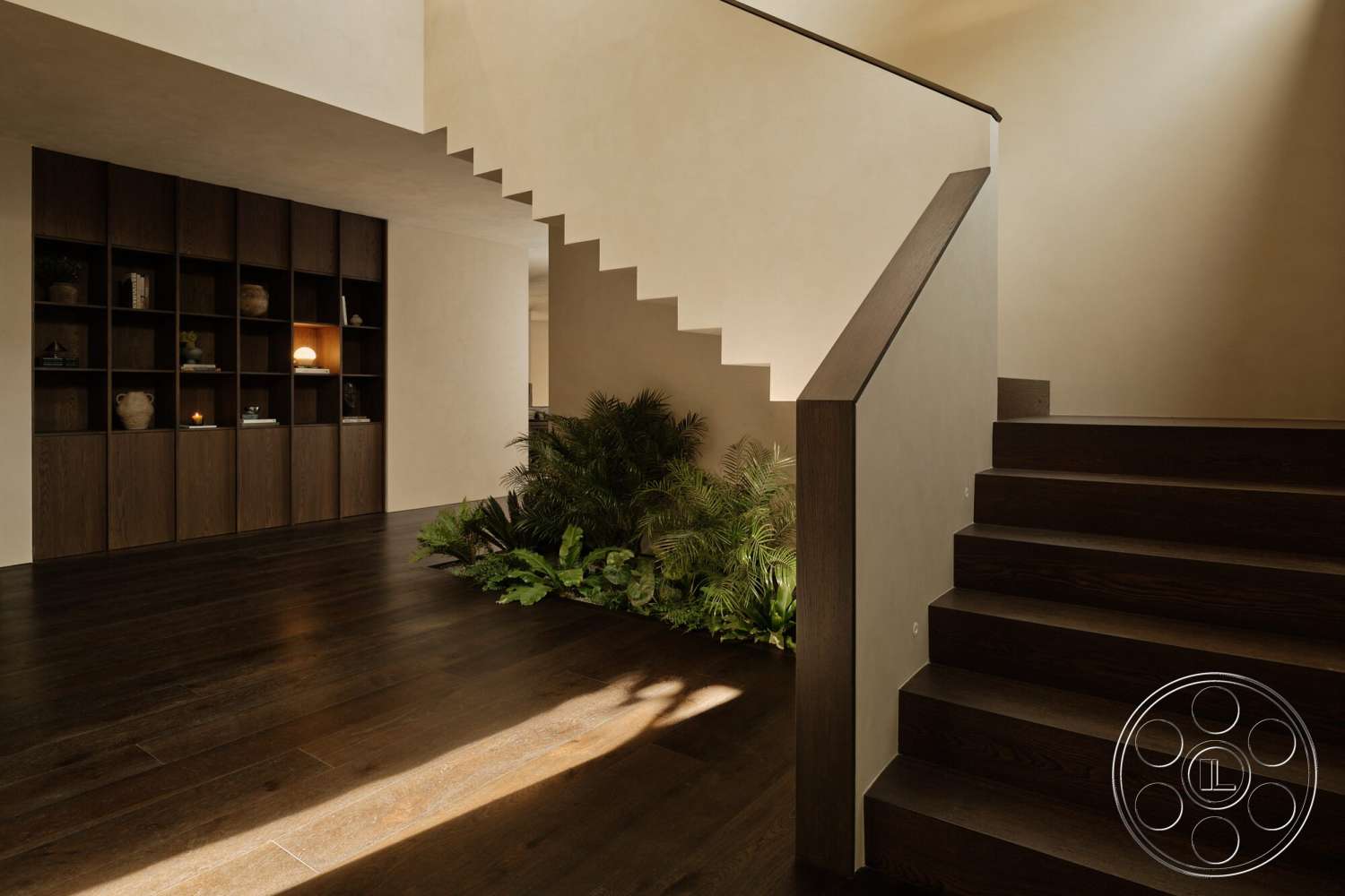 Modern 530 - dark hardwood flooring, contemporary staircase, integrated lighting features, angular staircase design, light beige plaster walls, exposed plant accents, open shelving storage unit, modern handrail detail