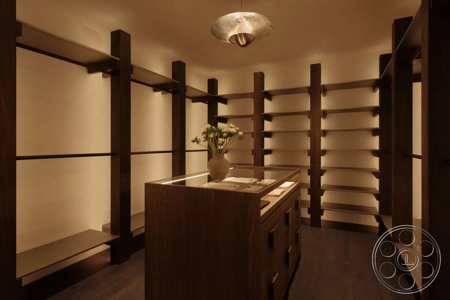Modern 530 - recessed lighting, minimalist design, dark wood shelving, plank hardwood flooring, modern closet space, wood storage island, wooden drawer front, neutral wall finish, declarative light fixture