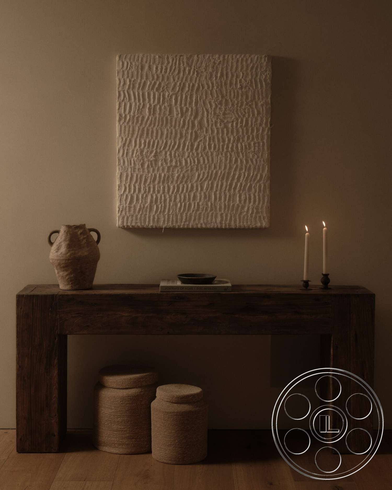 Modern 531 - minimalist decor, neutral color palette, textured wall art, woven storage baskets, wooden floor, dim lighting, ceramic vase, natural wood console table, elegant candle holders