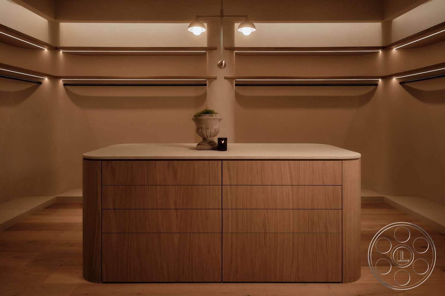 Modern 531 - light hardwood flooring, soft ambient lighting, built-in shelving units, wood cabinetry island, light concrete countertop, natural wood drawer fronts, earth-toned plaster walls