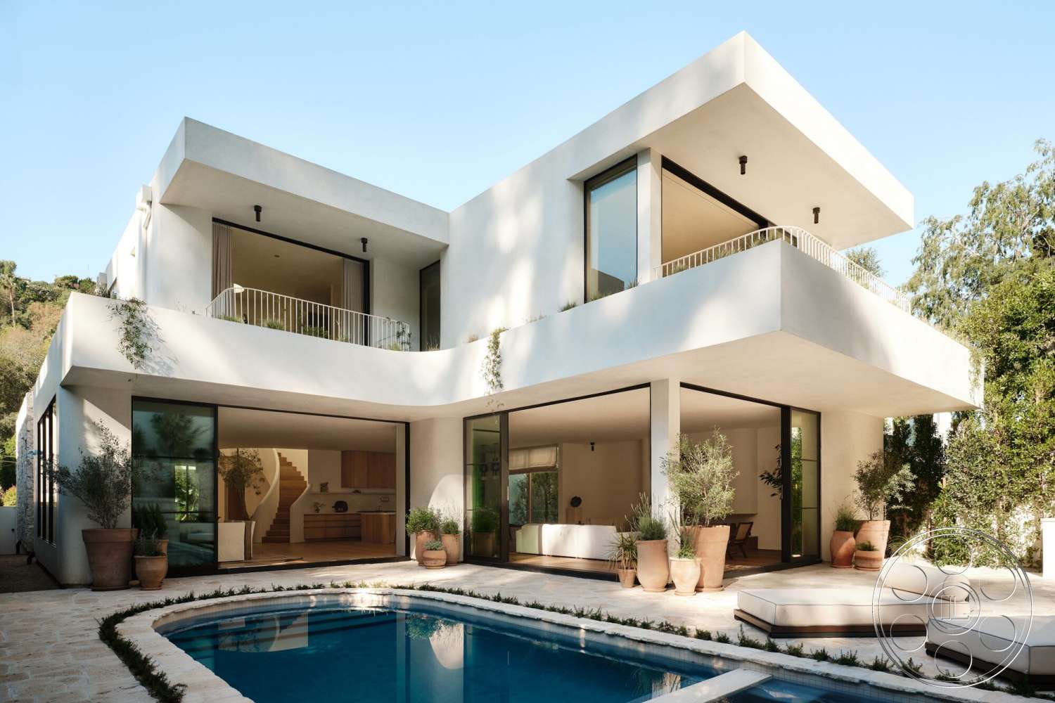 Modern 531 - exterior, modern architecture, large glass sliding doors, open floor plan, rectangular swimming pool, floor-to-ceiling windows, balcony with railing, outdoor lounging area, minimalist landscaping, stone pool deck, flat roof design, stucco wall finish, terracotta planter pots, softened edges of structure, integrated vegetation