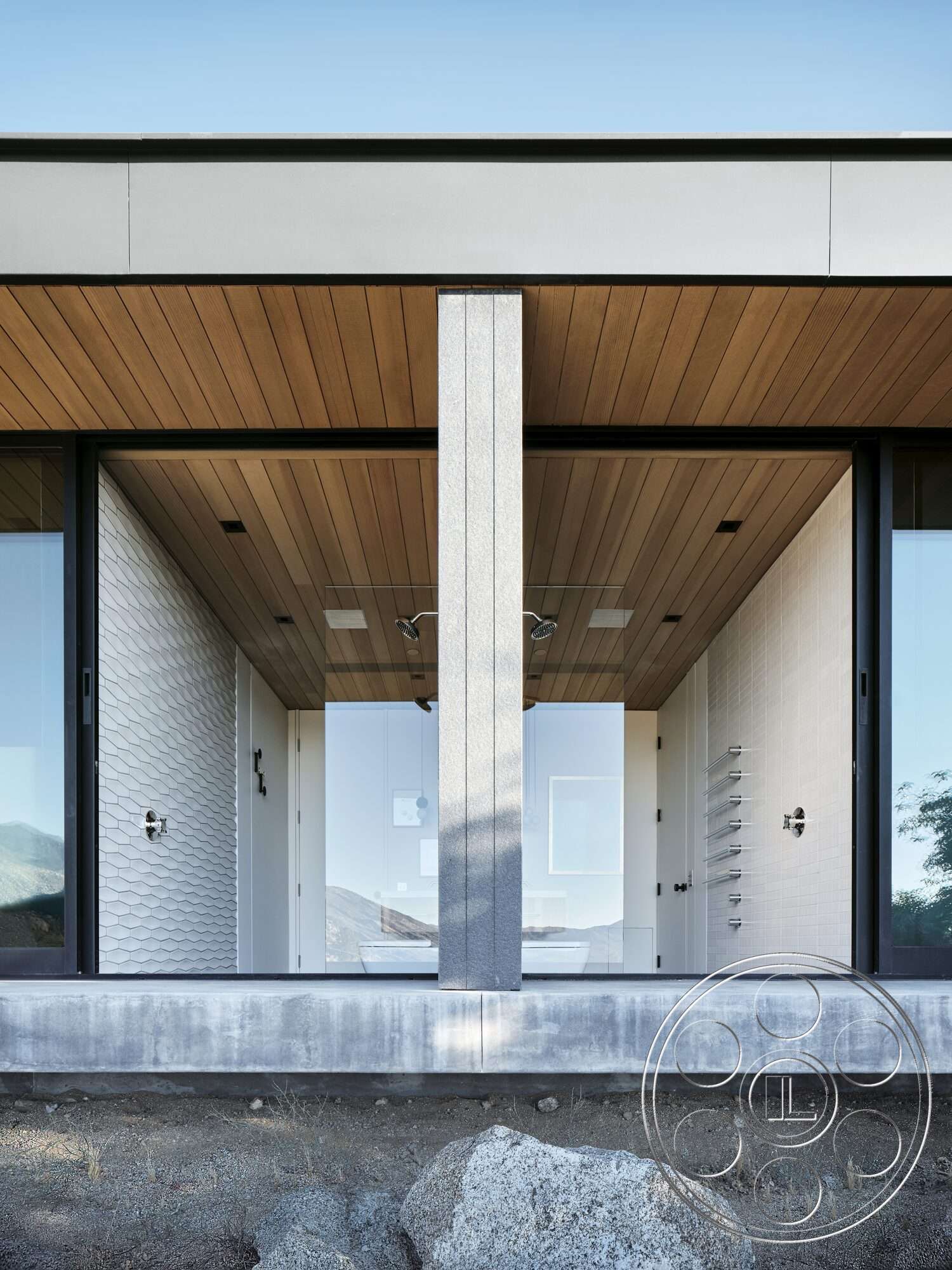 Palm Springs 110 - exterior, minimalist design, large glass windows, modern architectural style, horizontal wood paneling, concrete base, textured tile wall, rectangular structure, natural stone landscape, wood ceiling details