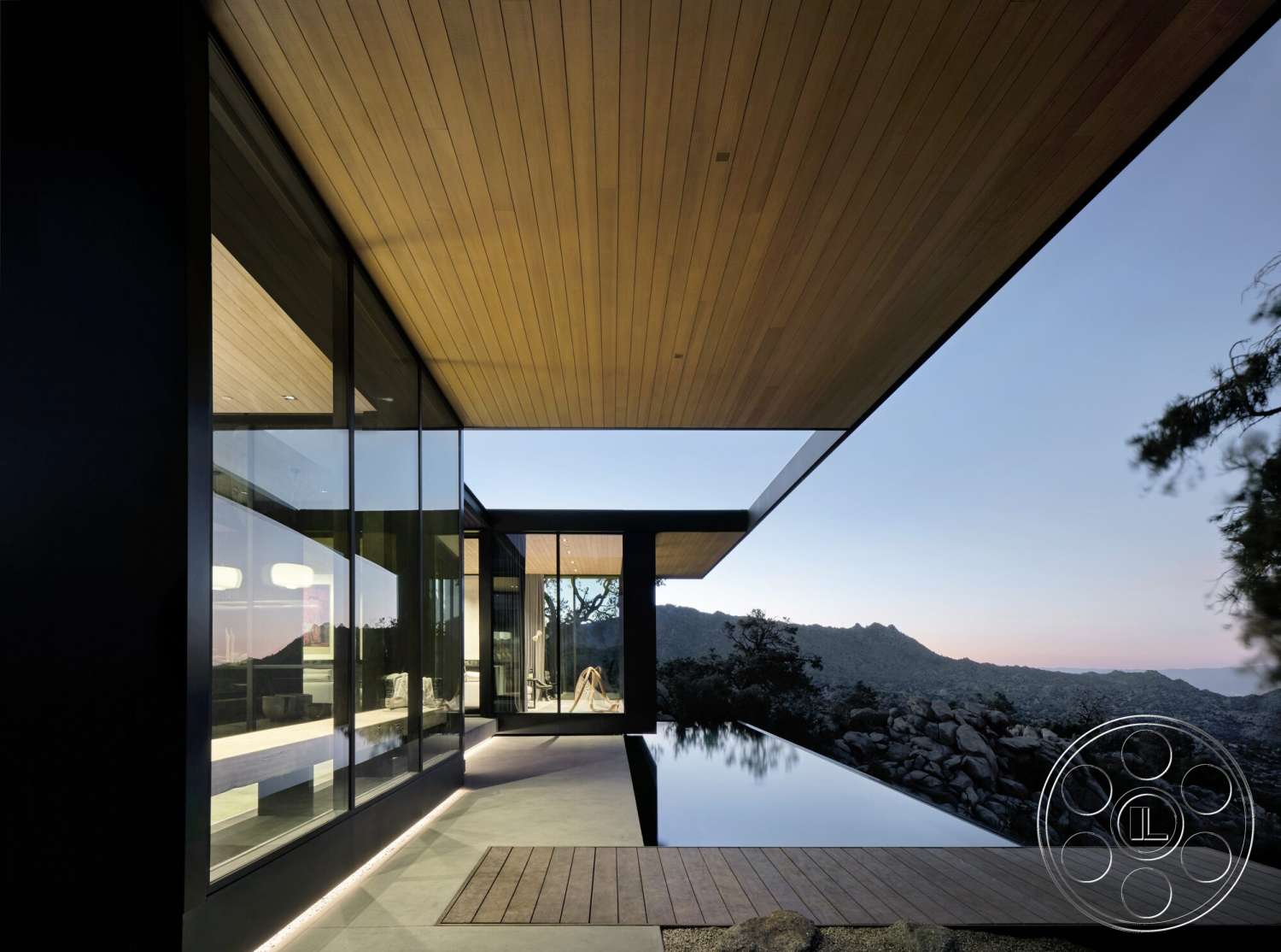 Palm Springs 110 - exterior, modern architecture, minimalist design, wood ceiling, glass walls, floor-to-ceiling windows, infinity pool, horizontal wood paneling, landscape integration, mountain views, overhang roof, concrete patio flooring