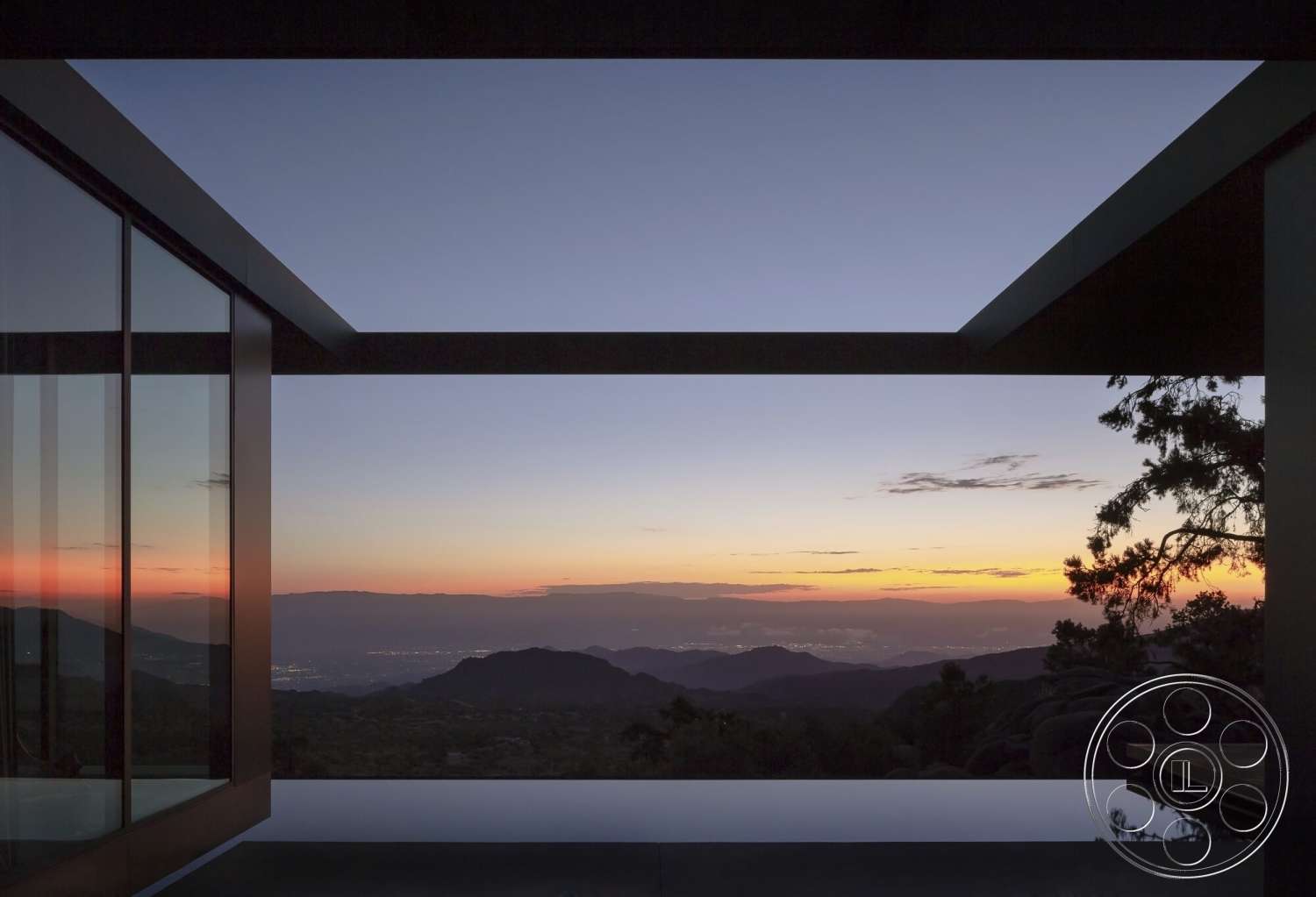 Palm Springs 110 - exterior, flat roof, minimalist design, glass walls, outdoor seating area, sunset backdrop, mountain view, open-air living space, concrete terrace, reflecting pool, steel framework