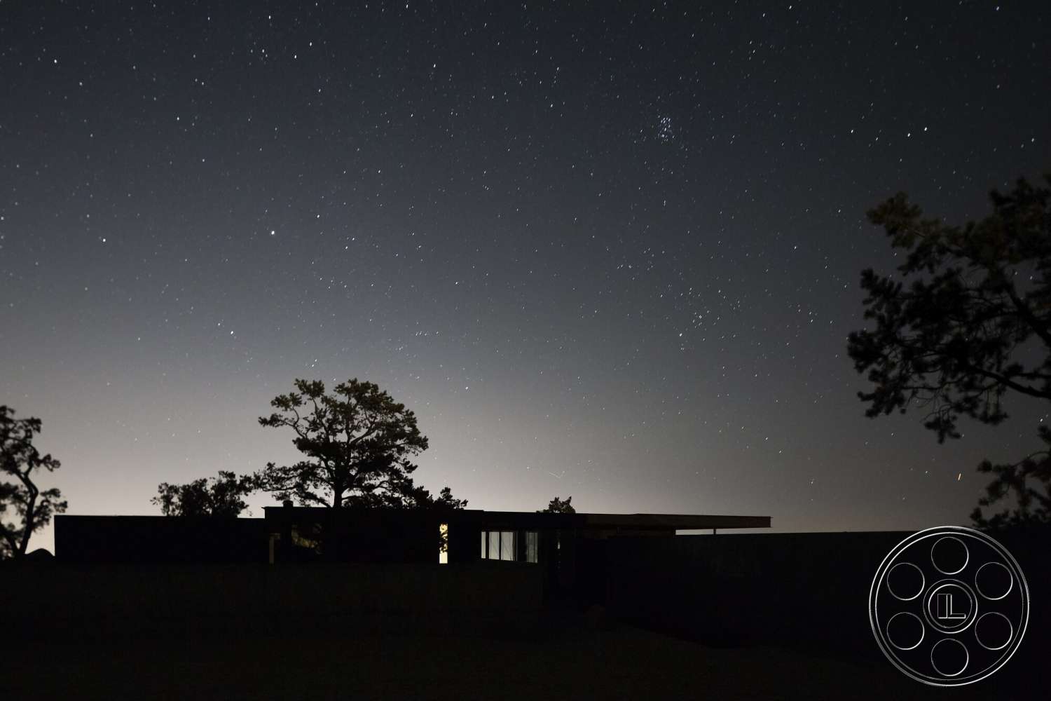 Palm Springs 110 - exterior, flat roof, minimalist design, concrete walls, nighttime setting, modern architectural style, landscape lighting, rectangle structure, tree silhouette, starry sky view