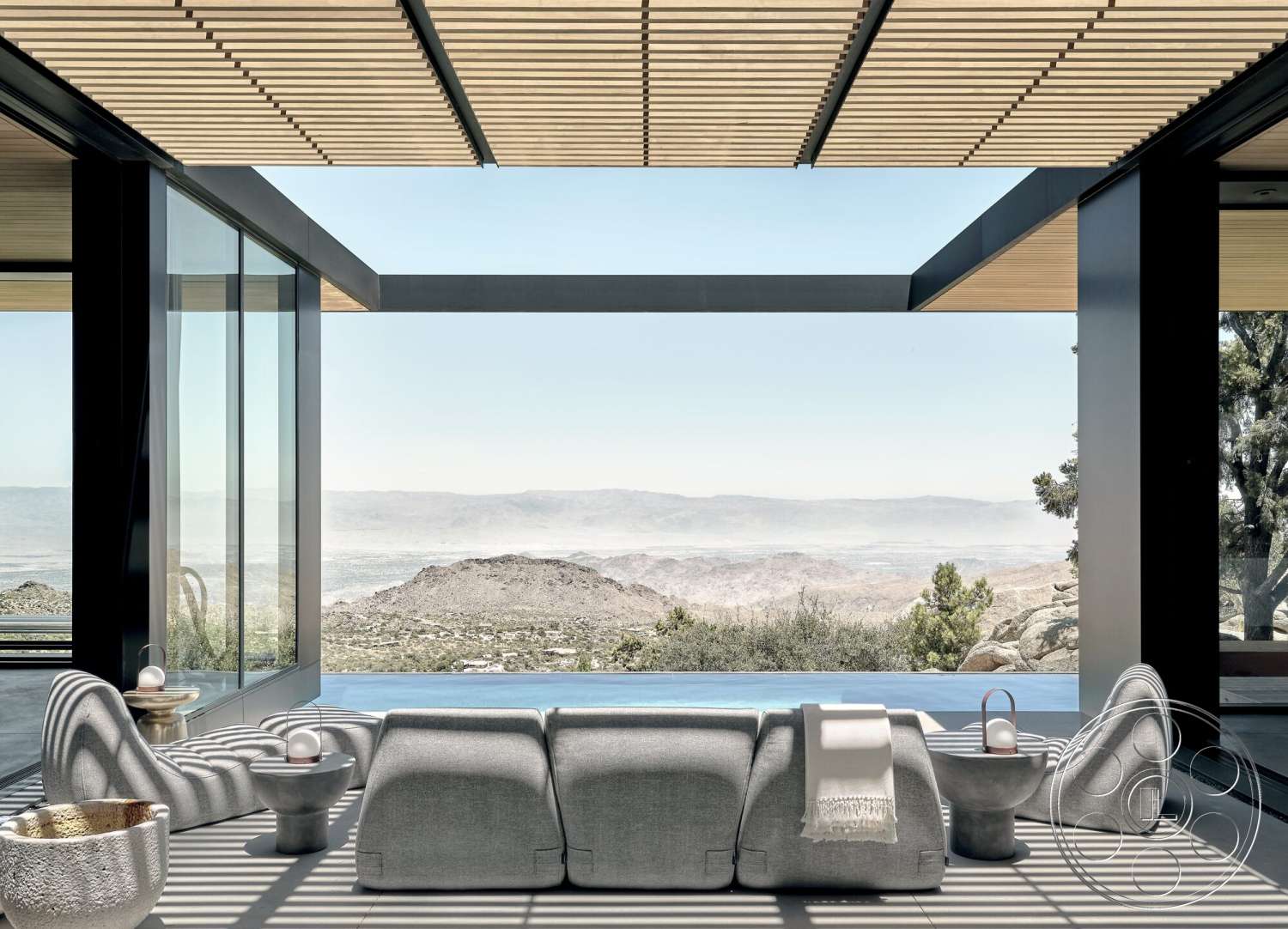 Palm Springs 110 - exterior, contemporary design, floor-to-ceiling windows, modern architectural style, mountain view, desert setting, concrete patio flooring, minimalist furniture design, rectangular infinity pool, integrated indoor-outdoor living space, natural stone landscape, wood slatted roof overhang