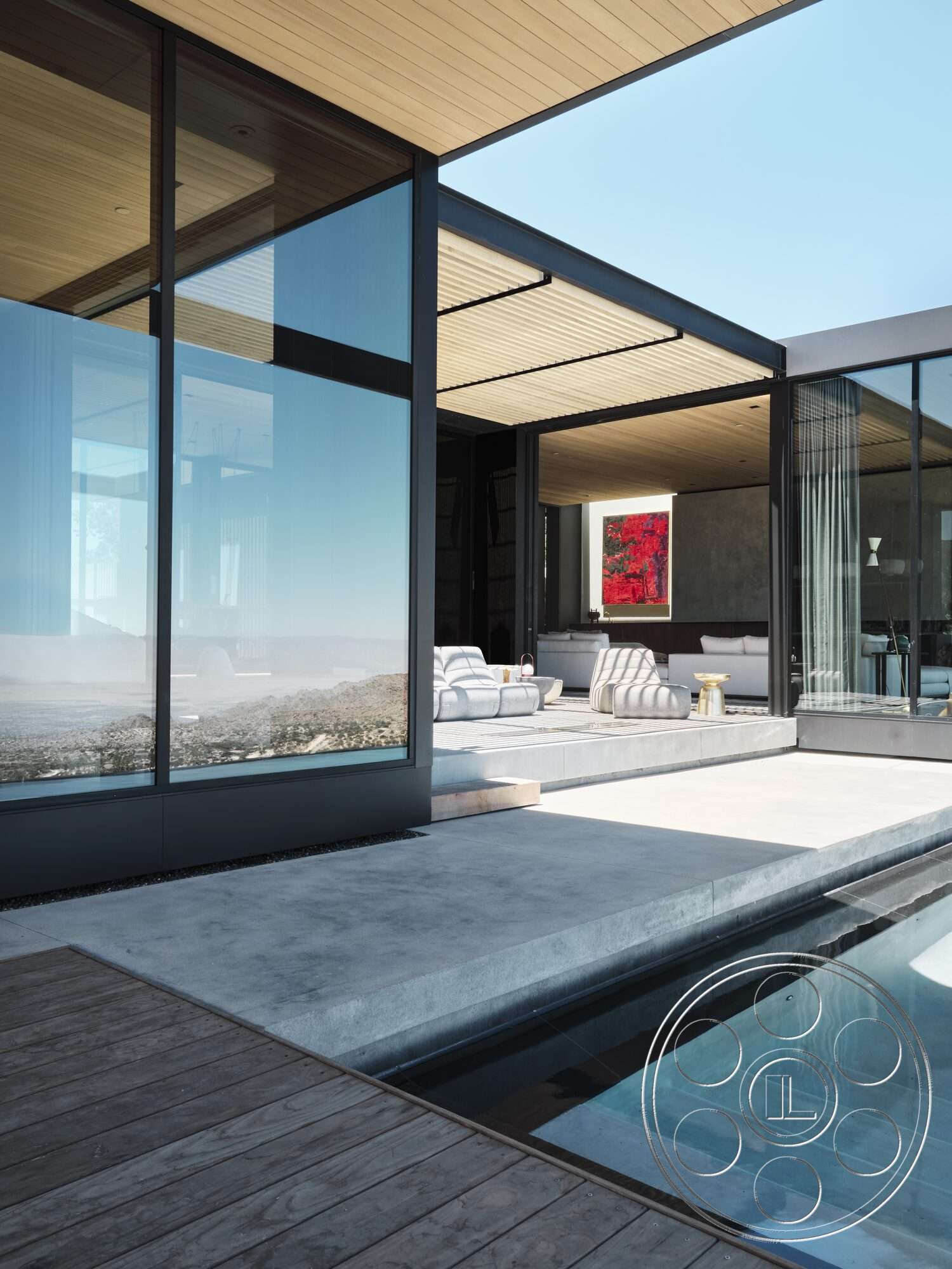 Palm Springs 110 - exterior, minimalist design, open floor plan, glass sliding doors, glass walls, modern outdoor furniture, textured concrete walls, rectangular swimming pool, artwork on wall, wood decking, wood beam ceiling, concrete patio floor, interior lounge area, panoramic mountain view, structured landscape