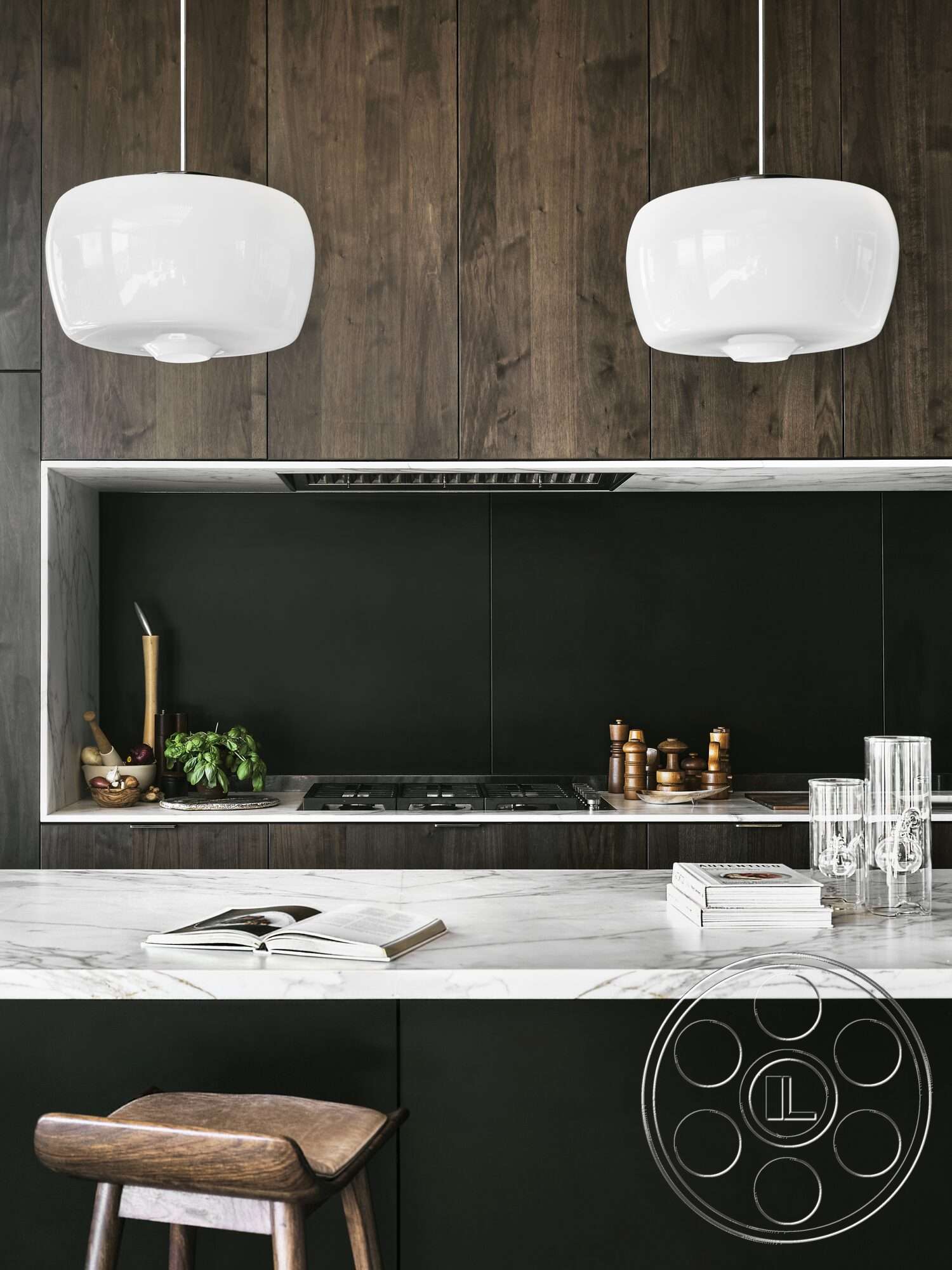 Palm Springs 110 - dark wood cabinetry, open shelving, white pendant lighting, marble countertop, black backsplash, stainless steel range hood, minimalist kitchen design, modern kitchen decor, walnut wood stool