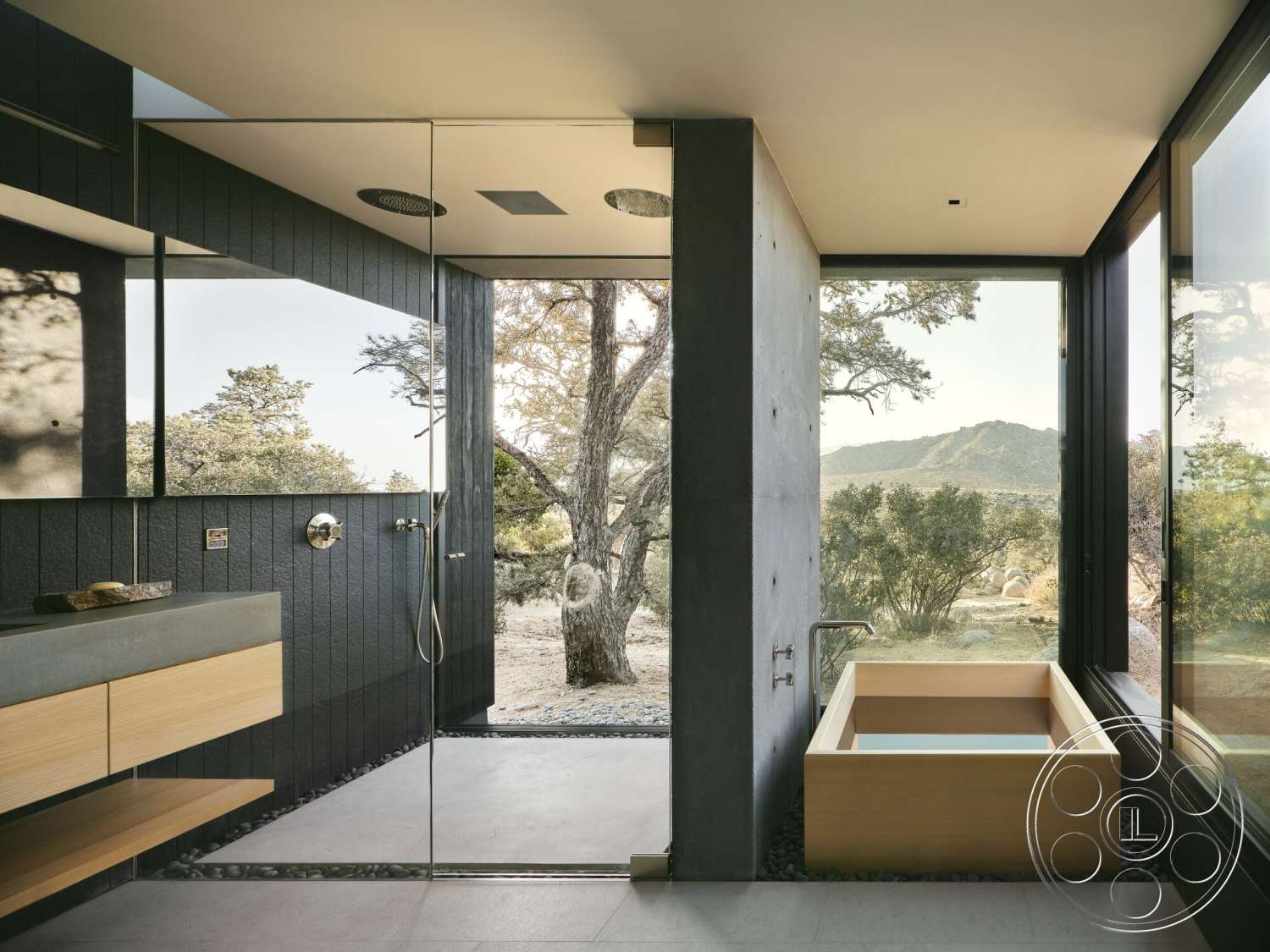 Palm Springs 110 - glass shower enclosure, floor-to-ceiling windows, slate tile flooring, mountain view setting, modern minimalist style, concrete shower walls, natural stone accent details, wood vanity with concrete countertop, wooden soaking tub
