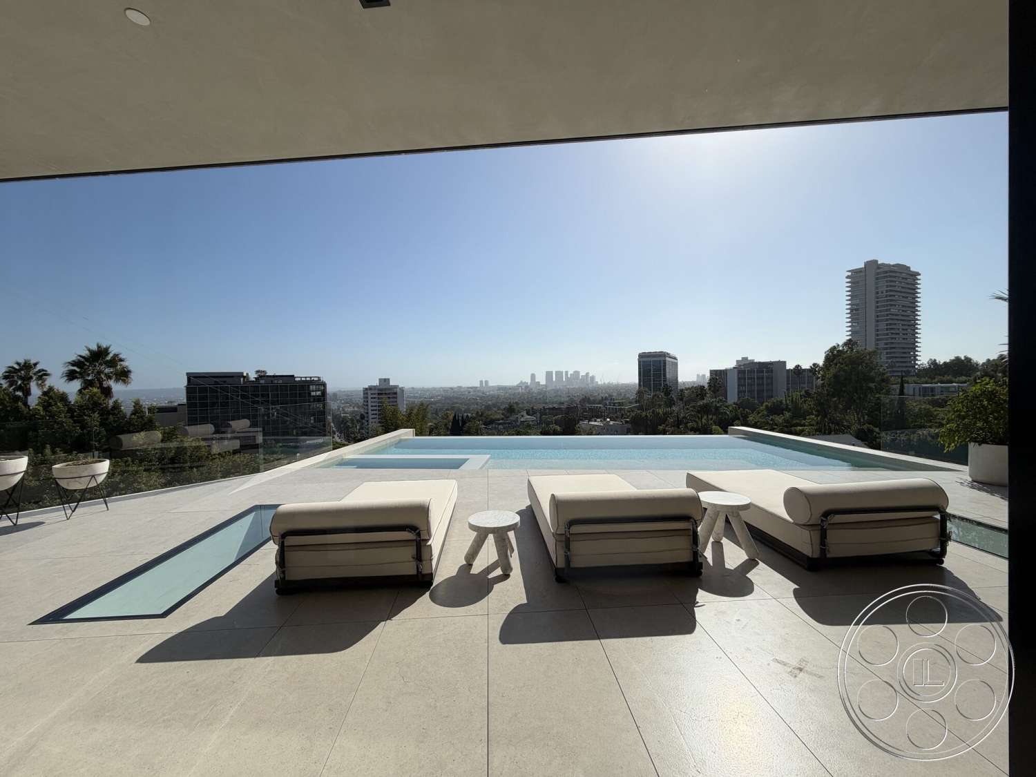 Modern 532 - exterior, modern architecture, glass railing, landscaped surroundings, city skyline view, infinity pool, concrete patio flooring, tile pool deck, open outdoor terrace, minimalist lounge chairs