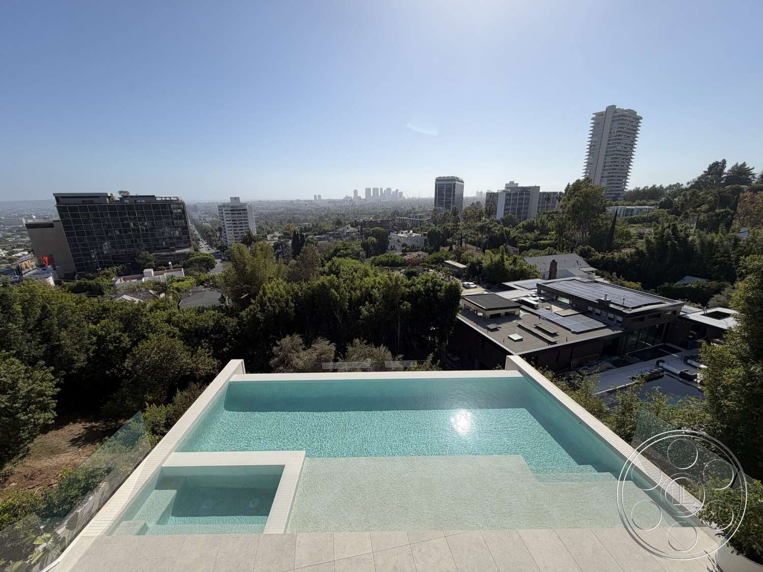 Modern 532 - exterior, landscaped greenery, city skyline view, infinity pool, luxury home, concrete pool deck, rectangular pool, minimalist outdoor space, flat roof design, urban hillside location, large panoramic windows, glass pool railing, sleek modern architecture