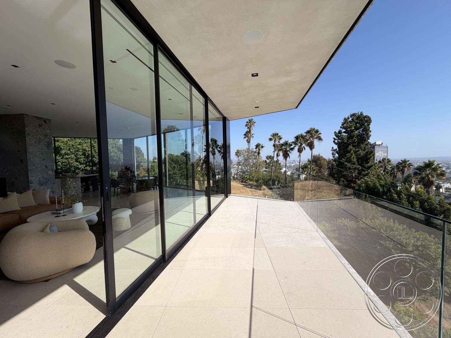 Modern 532 - exterior, stone accent wall, landscaped garden view, minimalist furniture, modern outdoor space, hillside location, flat roof design, contemporary architectural style, floor-to-ceiling glass windows, concrete patio floor