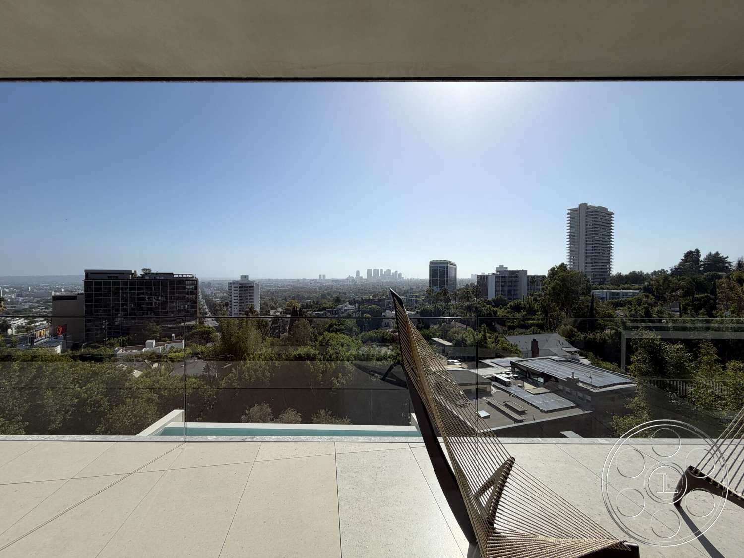Modern 532 - exterior, glass railing, modern architectural style, city skyline view, concrete patio flooring, rectangular infinity pool