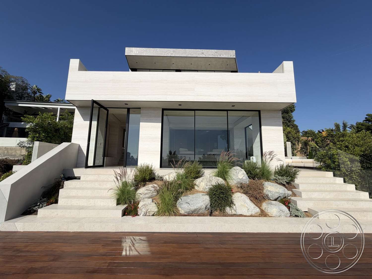 Modern 532 - exterior, flat roof, modern design elements, concrete walls, concrete steps, large floor-to-ceiling windows, grass landscaping, wooden deck flooring, minimalist architectural style, natural stone landscaping, glass dooring