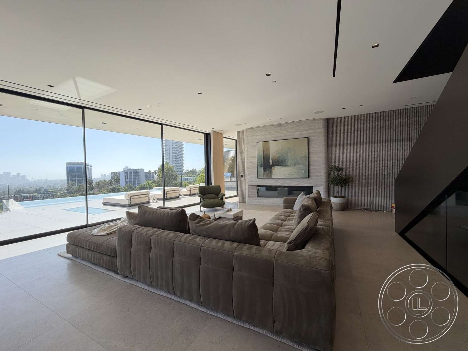 Modern 532 - minimalist decor, neutral color palette, natural light, seamless indoor-outdoor transition, urban skyline view, large floor-to-ceiling windows, concrete patio flooring, textured stone feature wall, open floor plan living space, rectangular swimming pool view, custom built-in fireplace, modern sectional suede sofa
