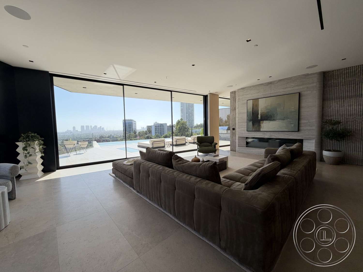 Modern 532 - neutral color palette, natural light, large glass sliding doors, open floor plan, modern art wall decor, stone flooring, high ceiling, contemporary design elements, city skyline view, decorative indoor plant, luxury living room, poolside area, textured plaster wall, modern sectional sofa, minimalist fireplace