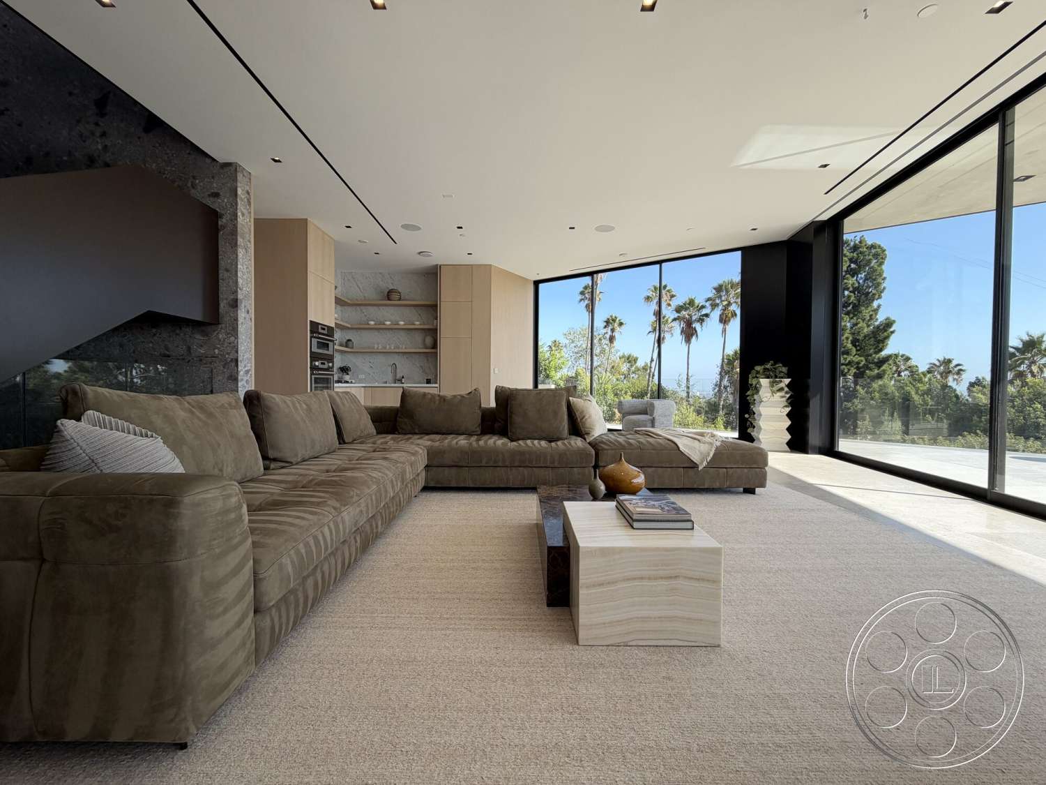 Modern 532 - modern architecture, open concept living space, minimalist coffee table, palm tree view, black stone accent wall, wooden kitchen cabinets, natural lighting from large windows, textured carpet flooring, glass wall panels, suede section sofa, horizontal lines in ceiling design, decorative vase on table