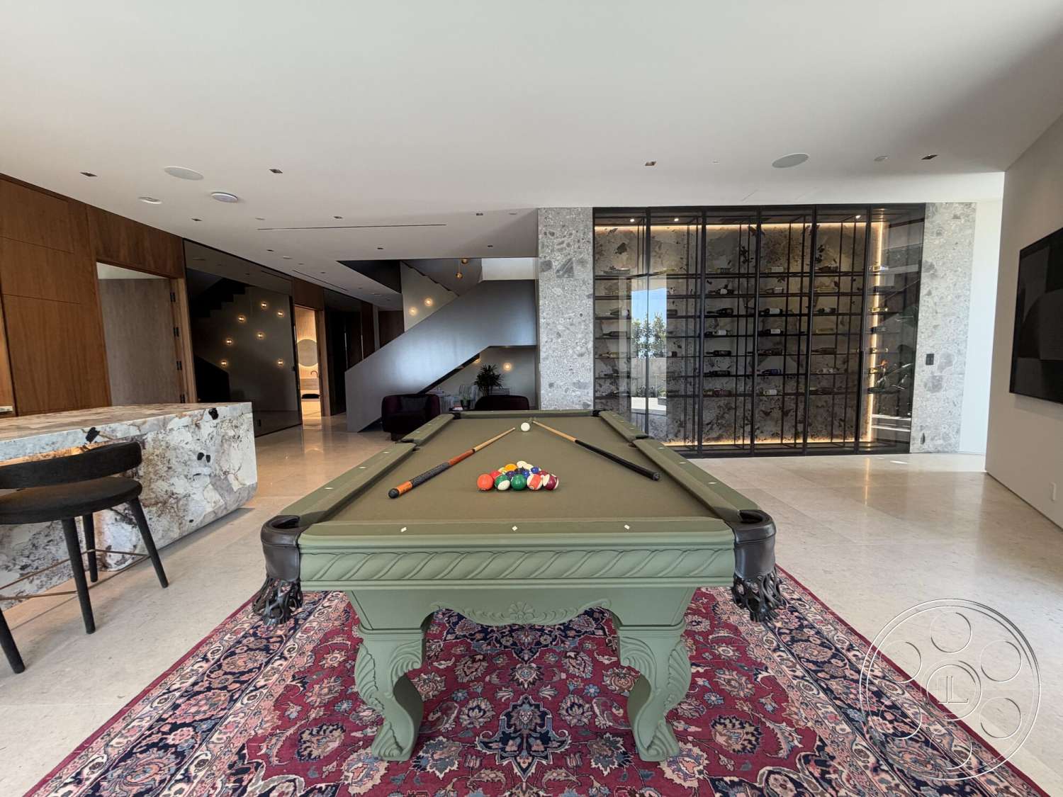 Modern 532 - tile flooring, open floor plan, floor-to-ceiling windows, modern staircase, traditional area rug, exposed wood paneling, soft recessed lighting, marble bar countertop, glass wine storage wall, green felt pool table