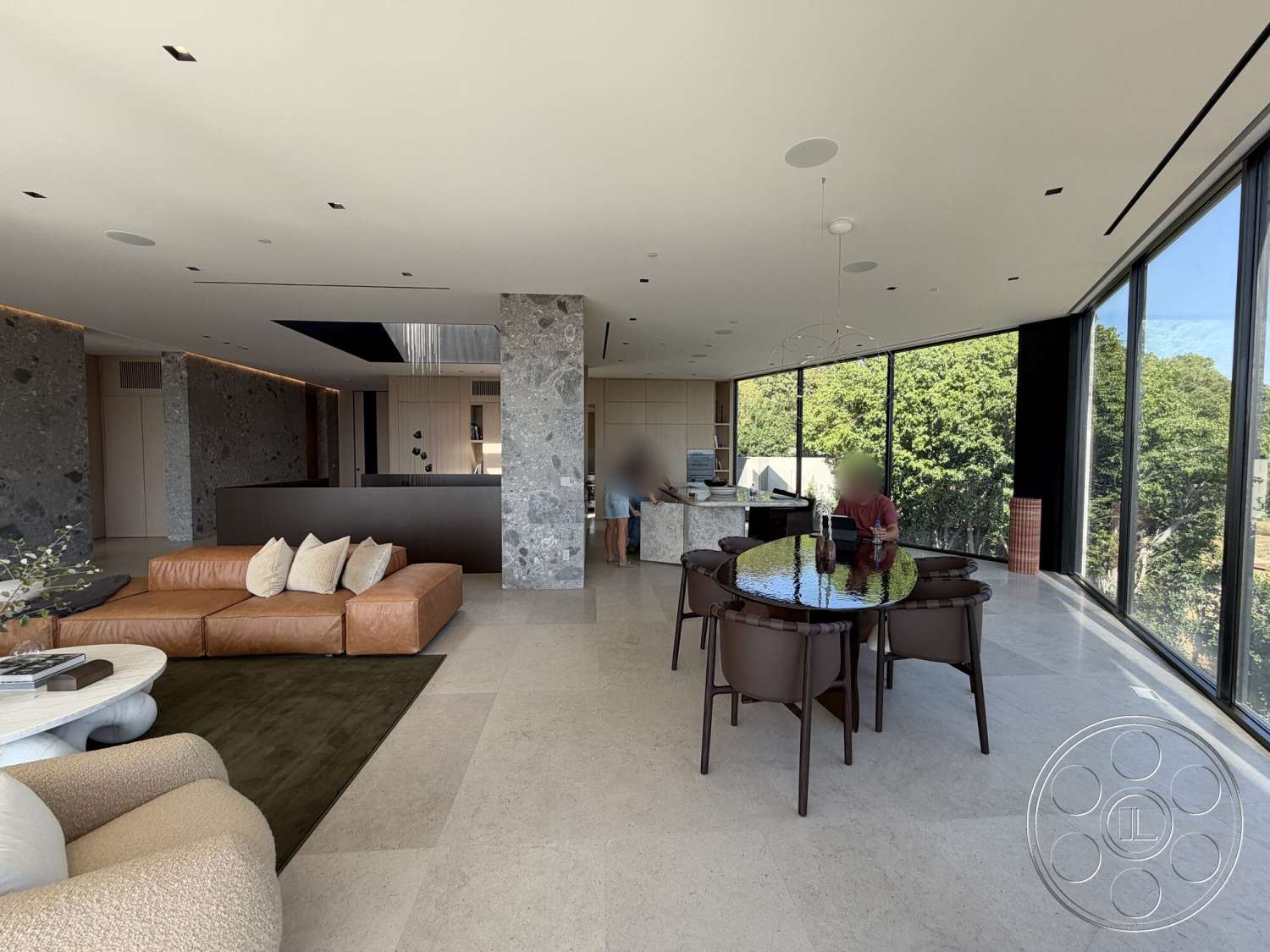 Modern 532 - minimalist decor, neutral color palette, open concept living space, stainless steel kitchen appliances, recessed ceiling lighting, textured ceiling details, glass floor-to-ceiling windows, contemporary dining chairs, natural stone feature wall, modern leather sectional sofa, wooden kitchen cabinetry, light-colored marble flooring, curved dining table, living room area rug