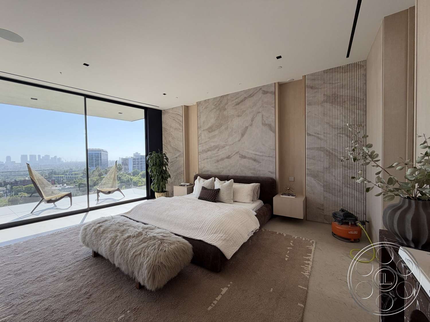 Modern 532 - open concept, neutral color palette, natural light, minimalist design, potted plant, glass railing, floor-to-ceiling windows, urban skyline view, textured plaster walls, decorative throw pillows, plush area rug, cozy bedding, wood panel accent wall, modern platform bed, concrete bedroom floor, corner chair