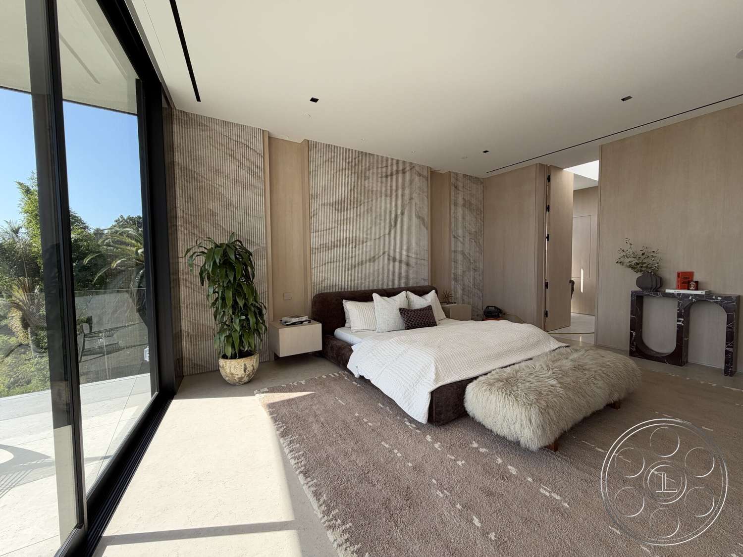 Modern 532 - neutral color palette, contemporary decor, floor-to-ceiling windows, decorative indoor plant, textured plaster walls, stylish console table, marble bedside table, hardwood bedroom floors, white painted walls, minimalist bedroom design, fluffy area rug, natural stone accent wall, king-size upholstered bed, modern bedside lighting
