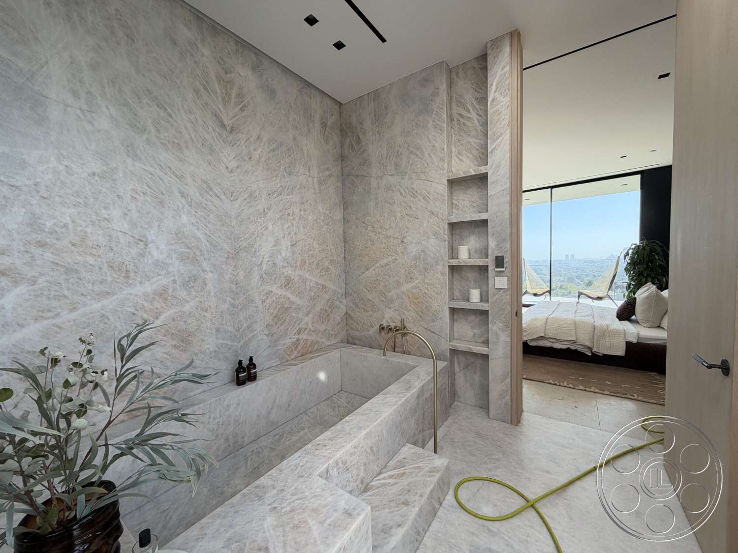 Modern 532 - neutral color palette, natural light, floating shelves, spa-like atmosphere, plant accents, minimalistic decor, floor-to-ceiling windows, marble flooring, modern bathroom fixtures, contemporary bathroom design, marble bathroom walls, marble bathtub surround, large glass windows with city view