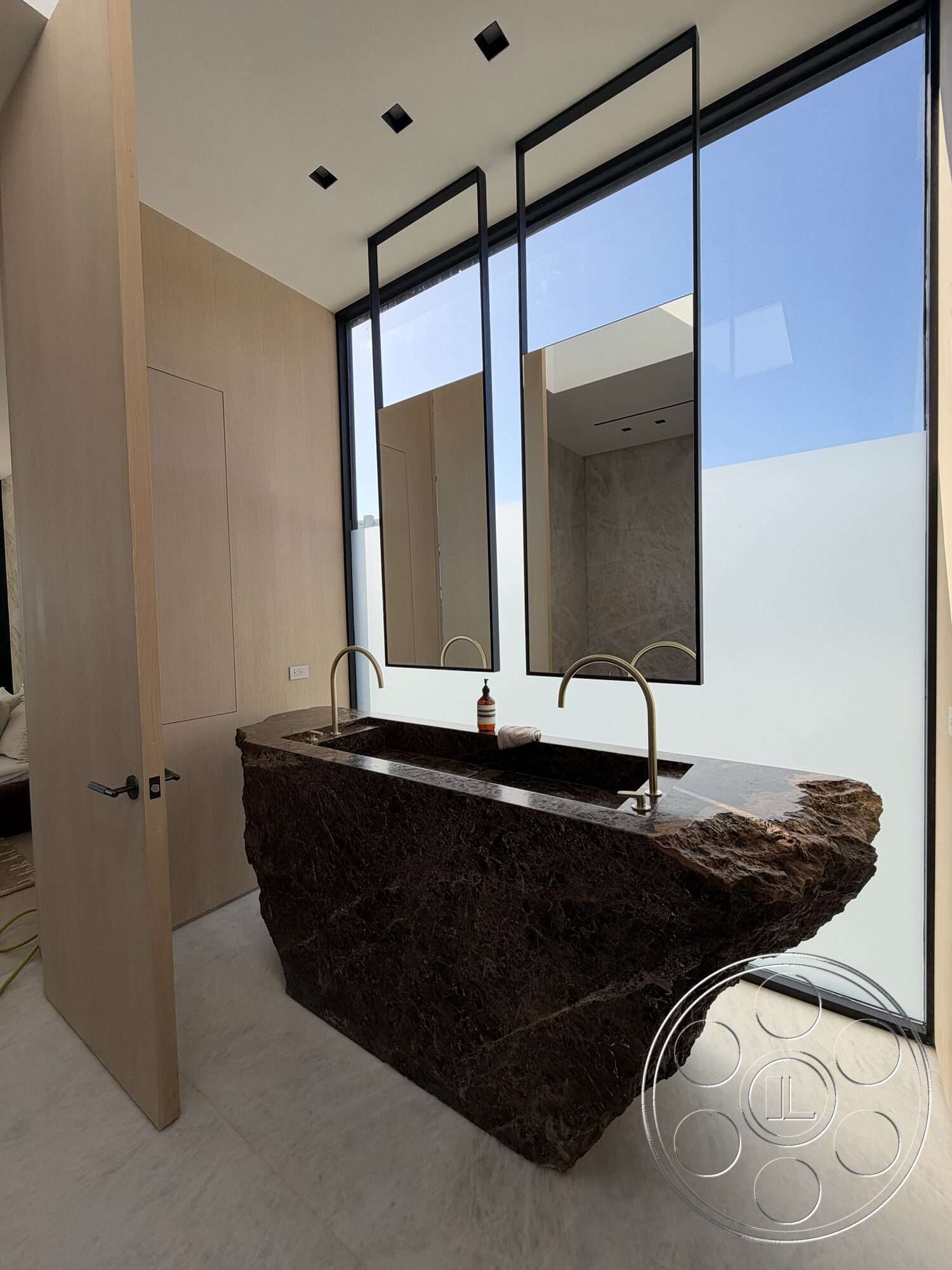 Modern 532 - neutral color palette, minimalist design, floor-to-ceiling windows, polished marble flooring, contemporary bathroom, wood panel cabinetry, rectangular room layout, exposed granite sink countertop, brown granite bathroom vanity, natural stone basin, black-framed mirrors