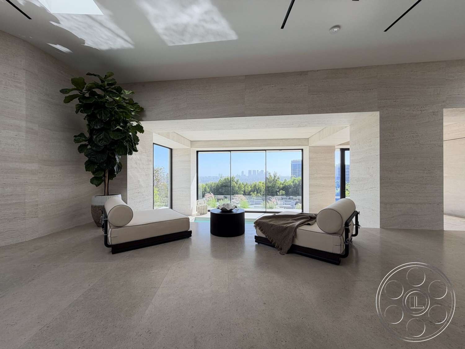 Modern 532 - open floor plan, floor-to-ceiling windows, spacious living area, modern architectural style, natural stone walls, urban view, black round coffee table, large indoor plant, bright room with natural light, minimalist lounge chairs, light-colored travertine flooring