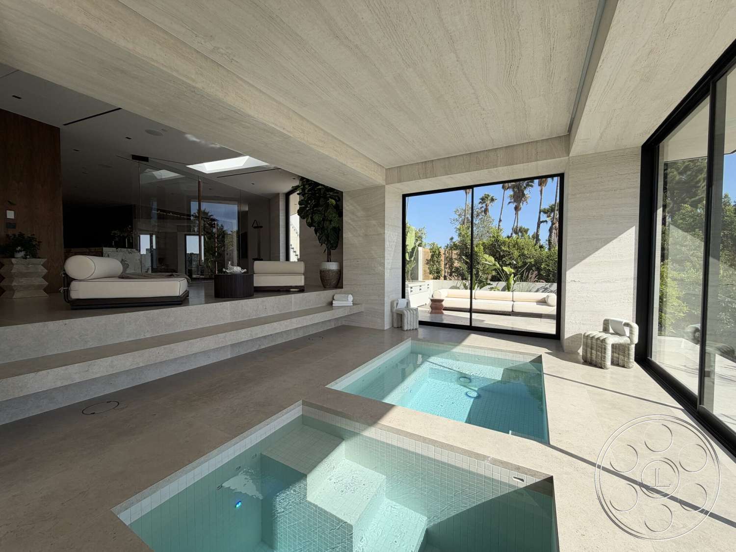 Modern 532 - neutral color palette, natural light, minimalist aesthetic, indoor-outdoor flow, glass sliding doors, landscape view, rectangular swimming pool, open-plan living space, wood beam ceiling, built-in seating area, travertine floor tiles